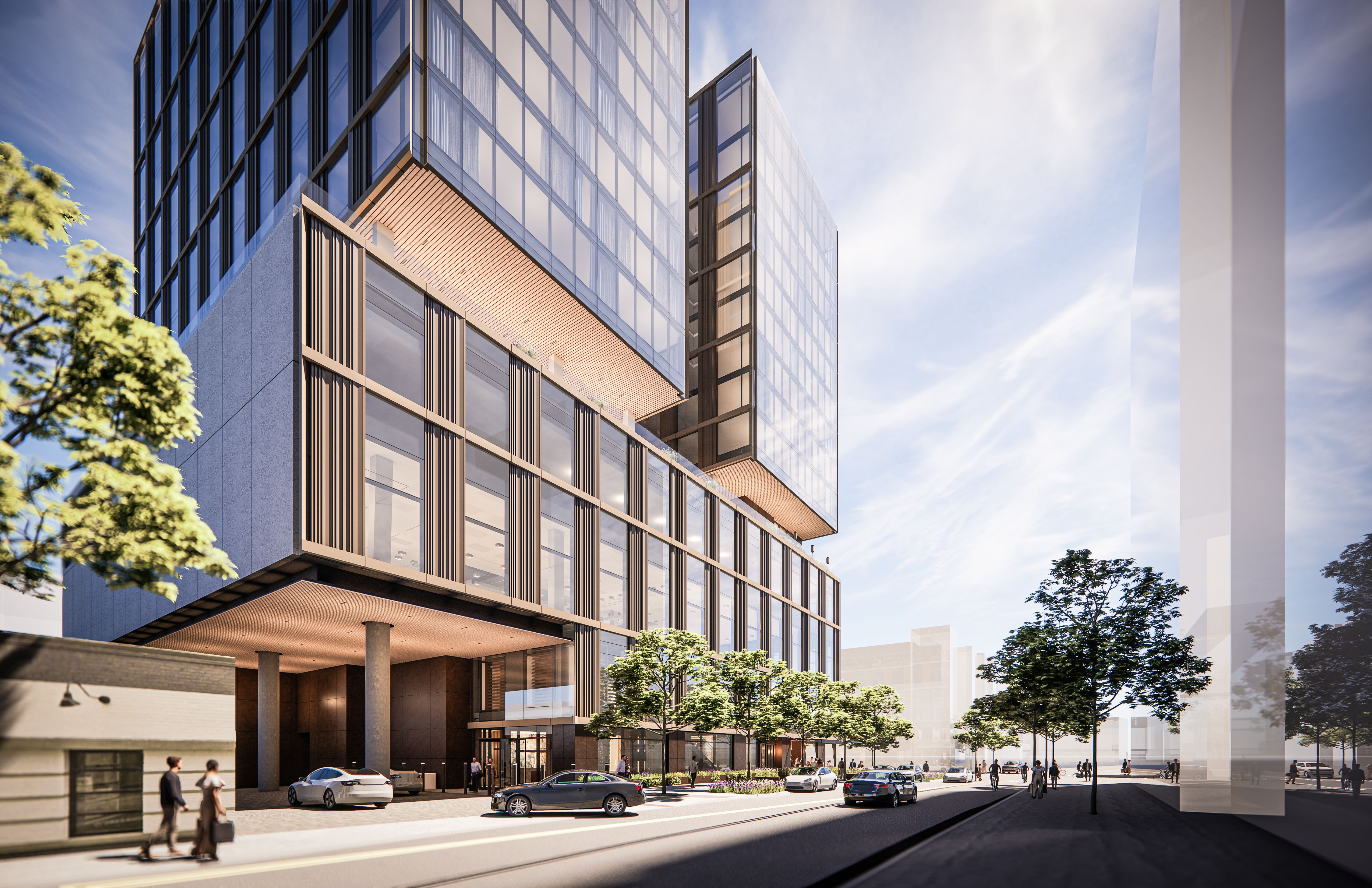 Contemporary glass office tower with a grid of windows and cantilevered balconies; reflective facade. Ground level shows cars, pedestrians, and trees beneath a bright blue sky.