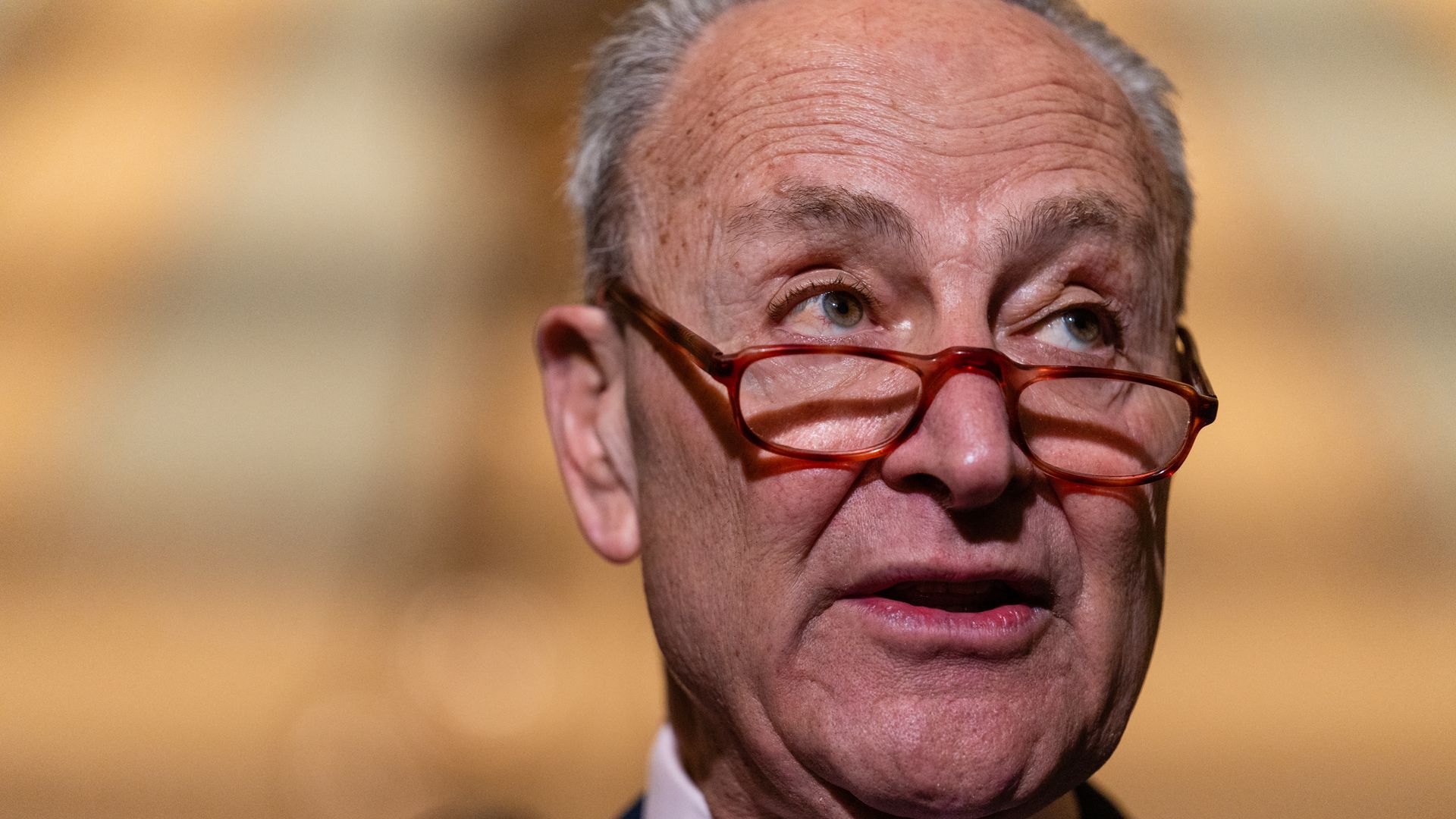 Senate Majority Leader Chuck Schumer is seen speaking at the Capitol.