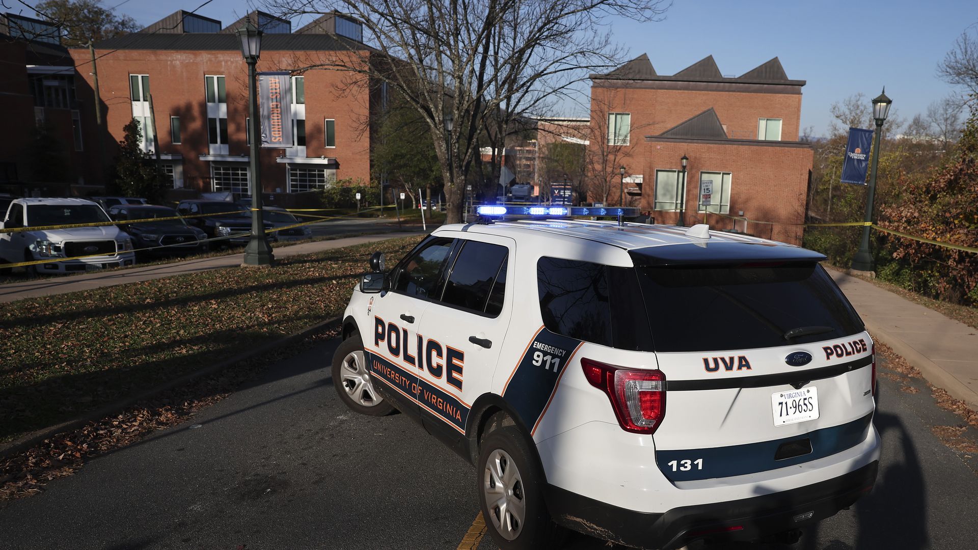 A law enforcement blocks access to the crime scene UVA