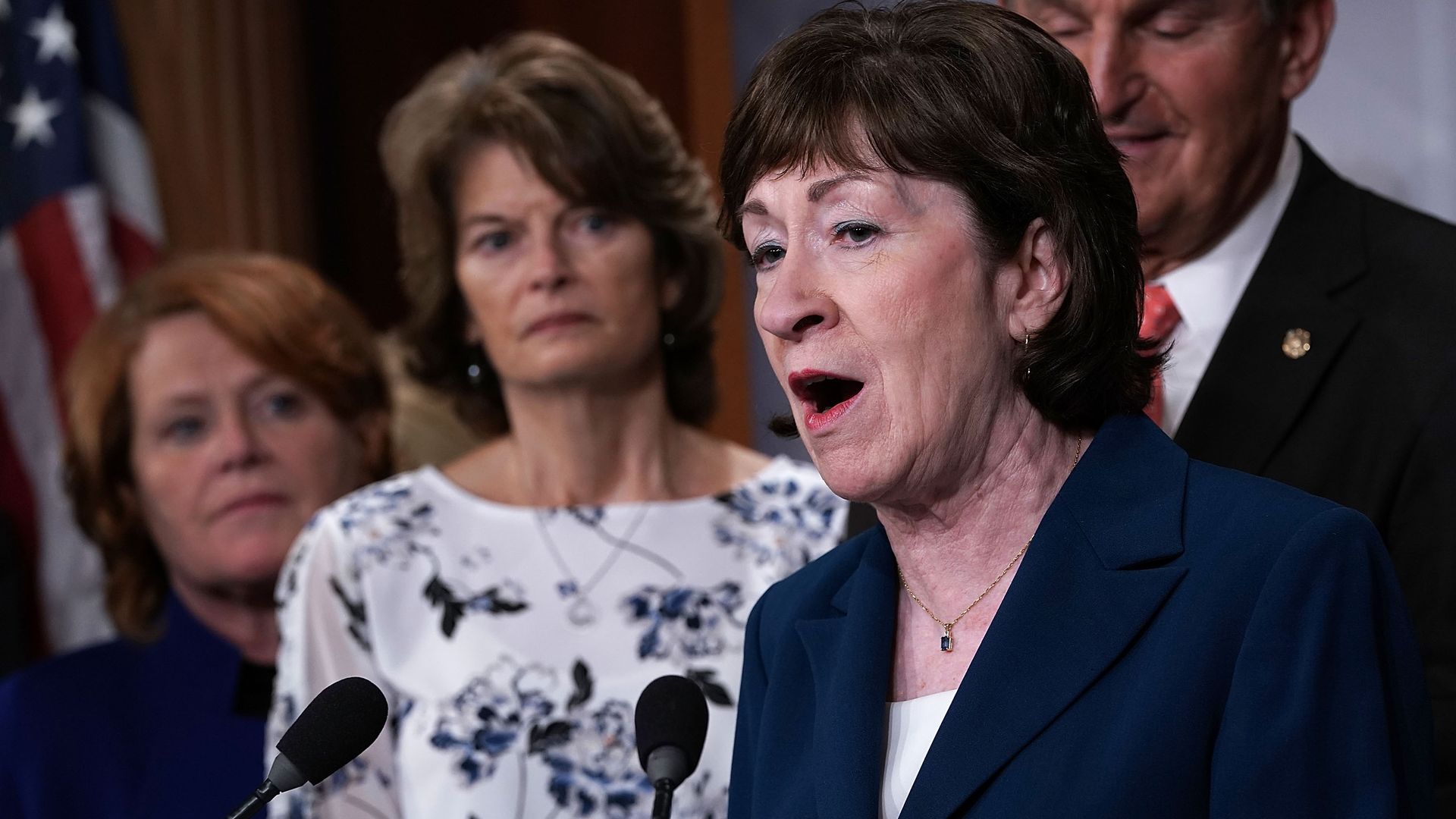 Susan Collins and Lisa Murkowski stand and speak 