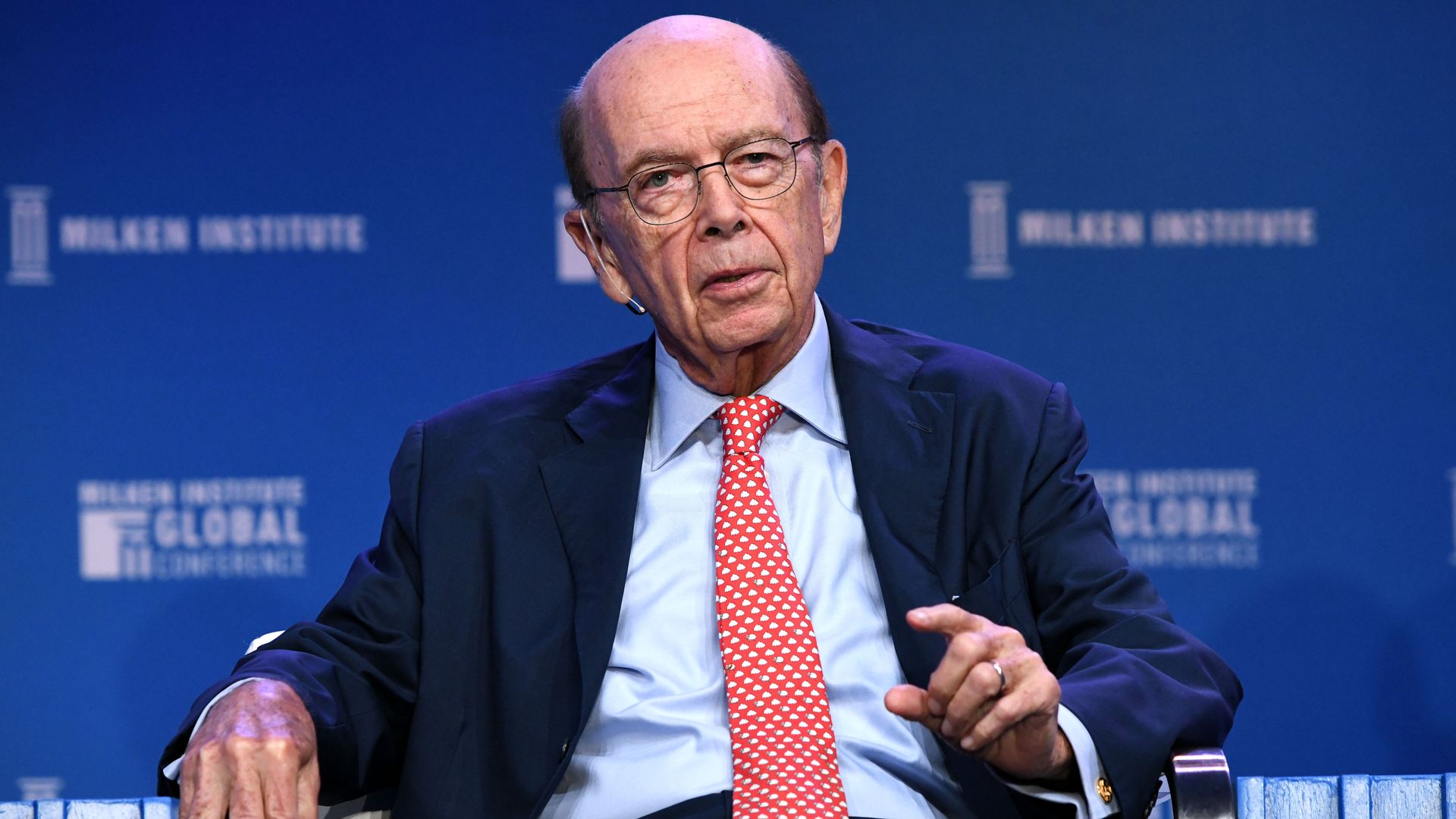 Wilbur Ross sitting in a chair.