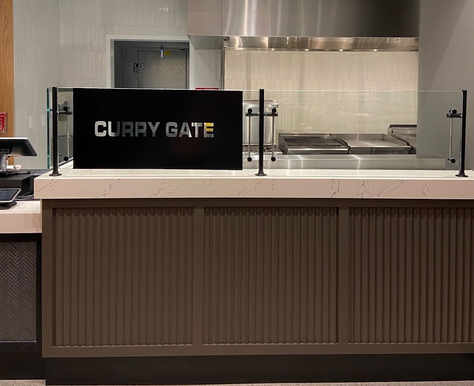 food stall with sign that says curry gate