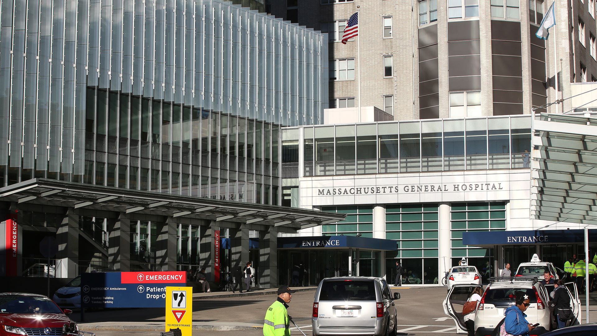 People walk outside Massachusetts General Hospital in Boston.