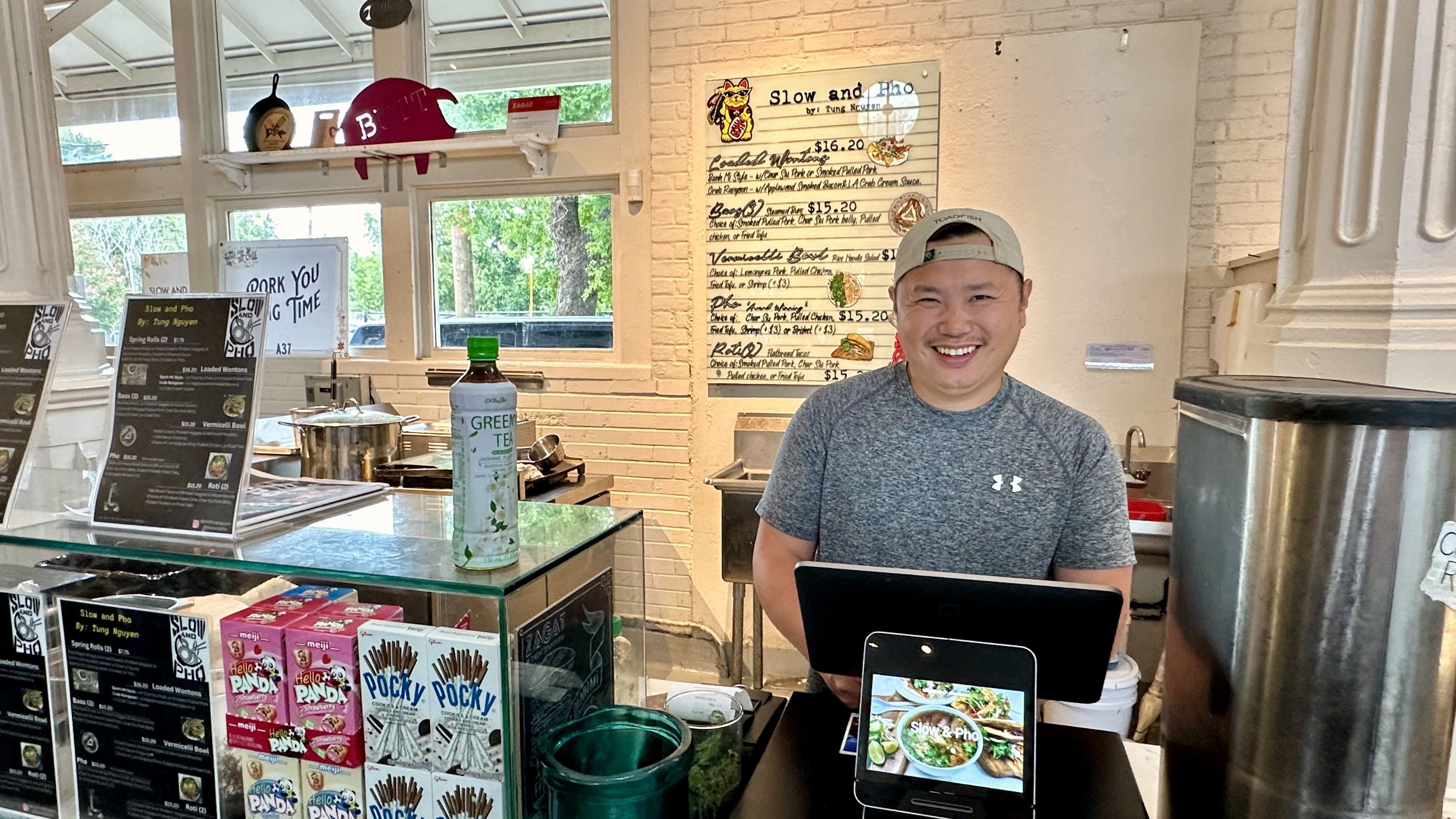 Image shows a chef at the Vietnamese stall in St. Roch Market.