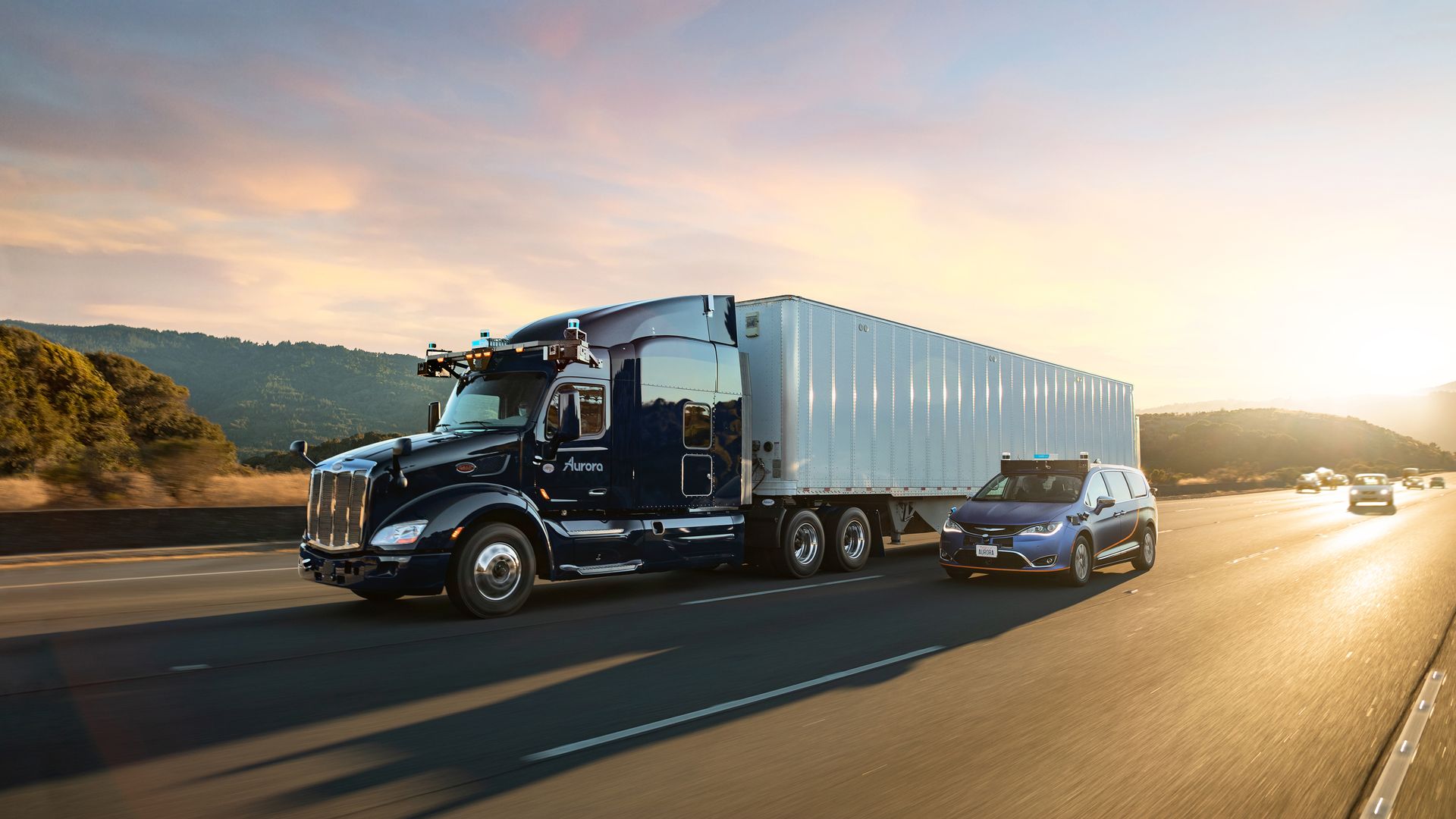 Image of self-driving semi-truck and minivan on the highway. 