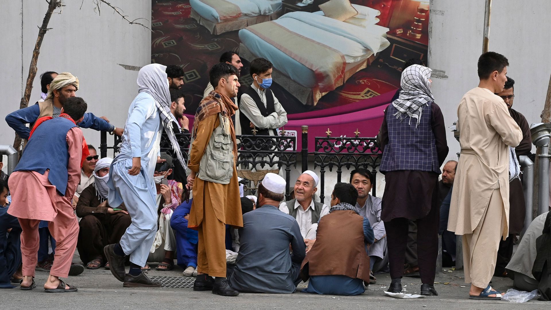 Afghans line up at a bank