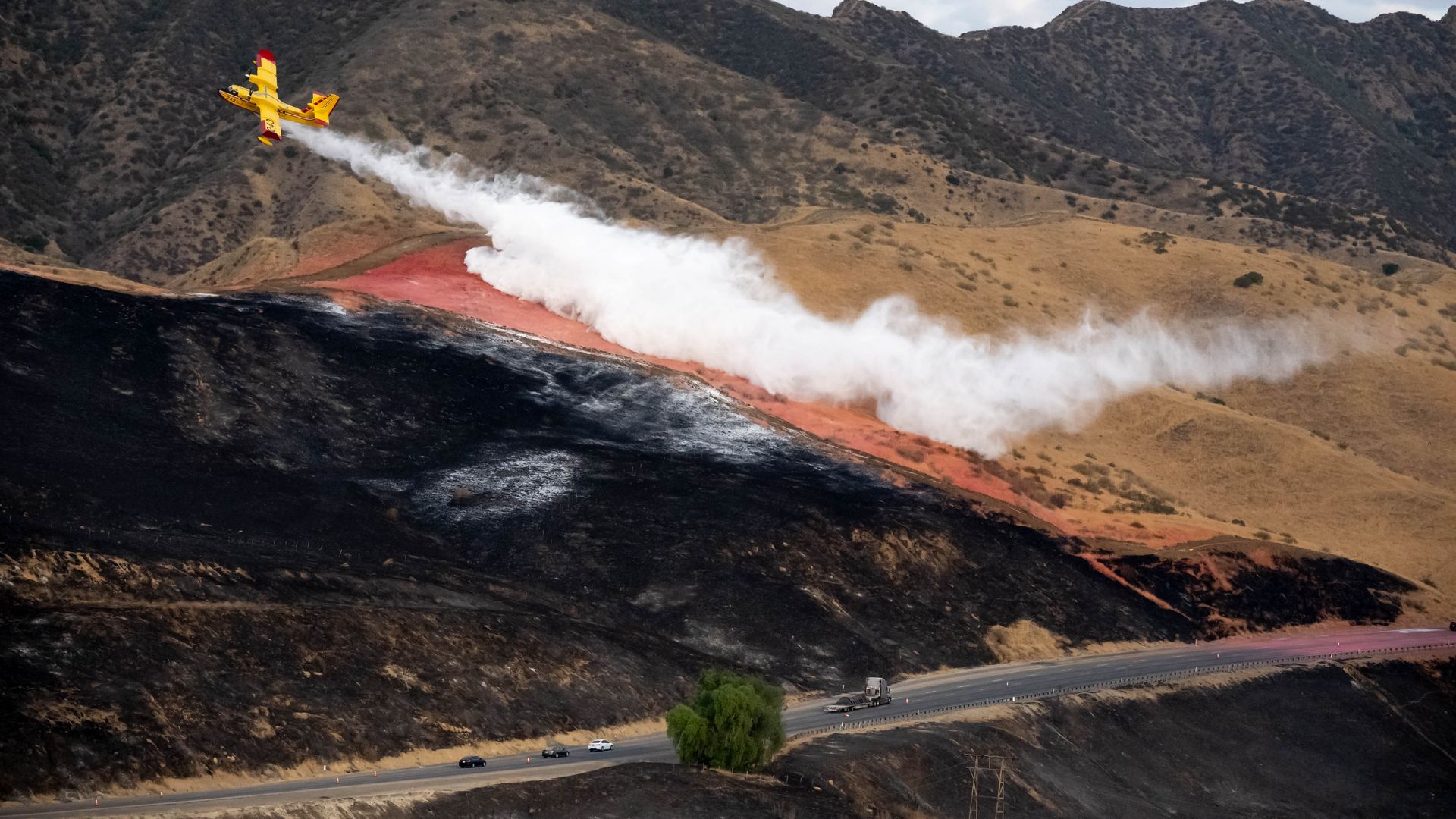 September 01:A Quebec Super scooper makes a water drop near the northbound I-5 freeway in Castic, CA Thursday, September 1.
