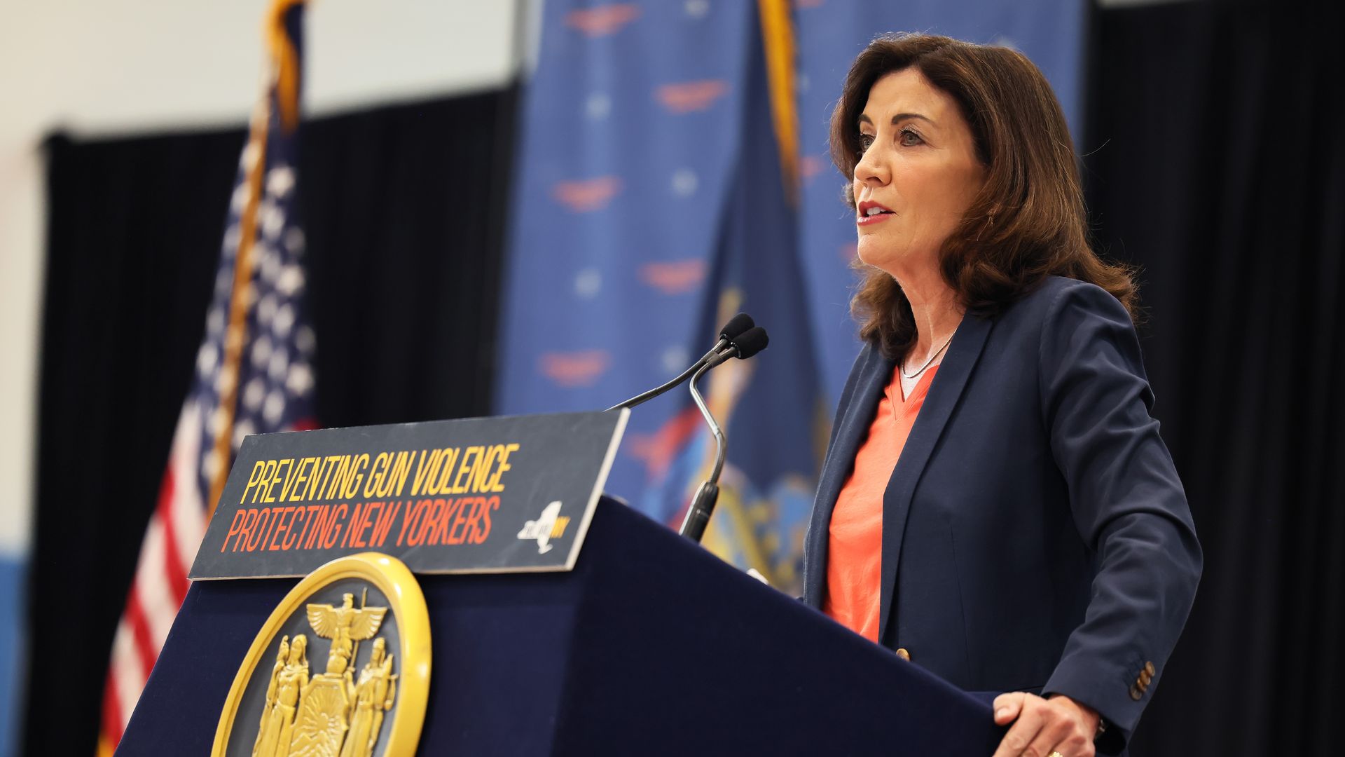 Photo of Kathy Hochul speaking from a podium