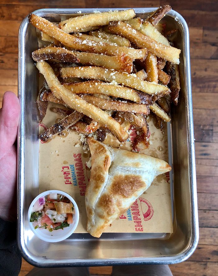 empanada and fries at felix empanadas at optimist hall