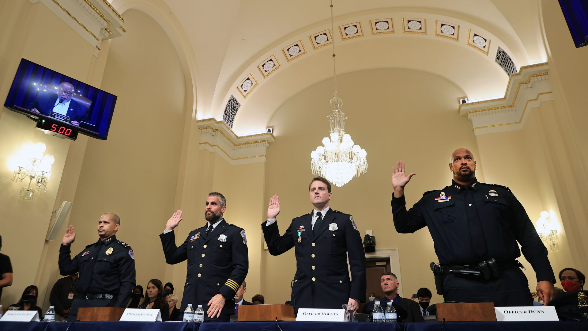 Four police officers are seen being sworn in before testifying to the Jan. 6 Select Committee.