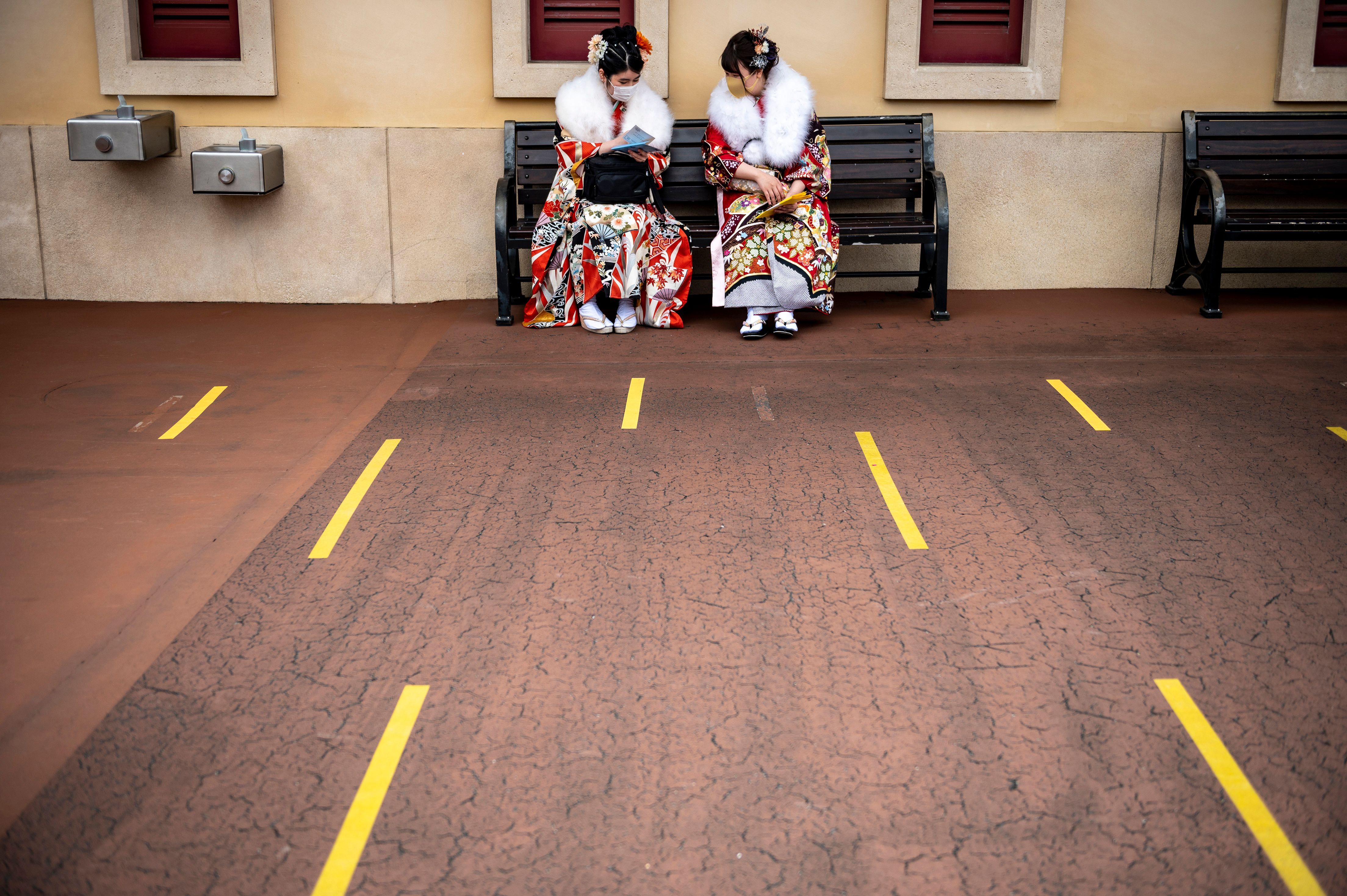  Twenty-year-old women wearing kimonos wait to attend a postponed "Coming-of-Age Day" celebration ceremony, due to the COVID-19 pandemic, at DisneySea in Urayasu on March 7