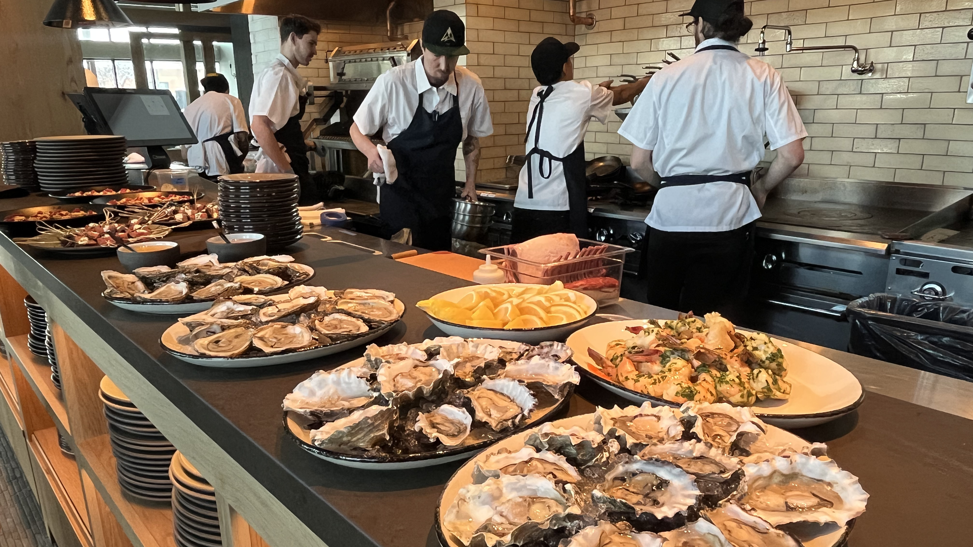 A plate of oysters and shrimp.
