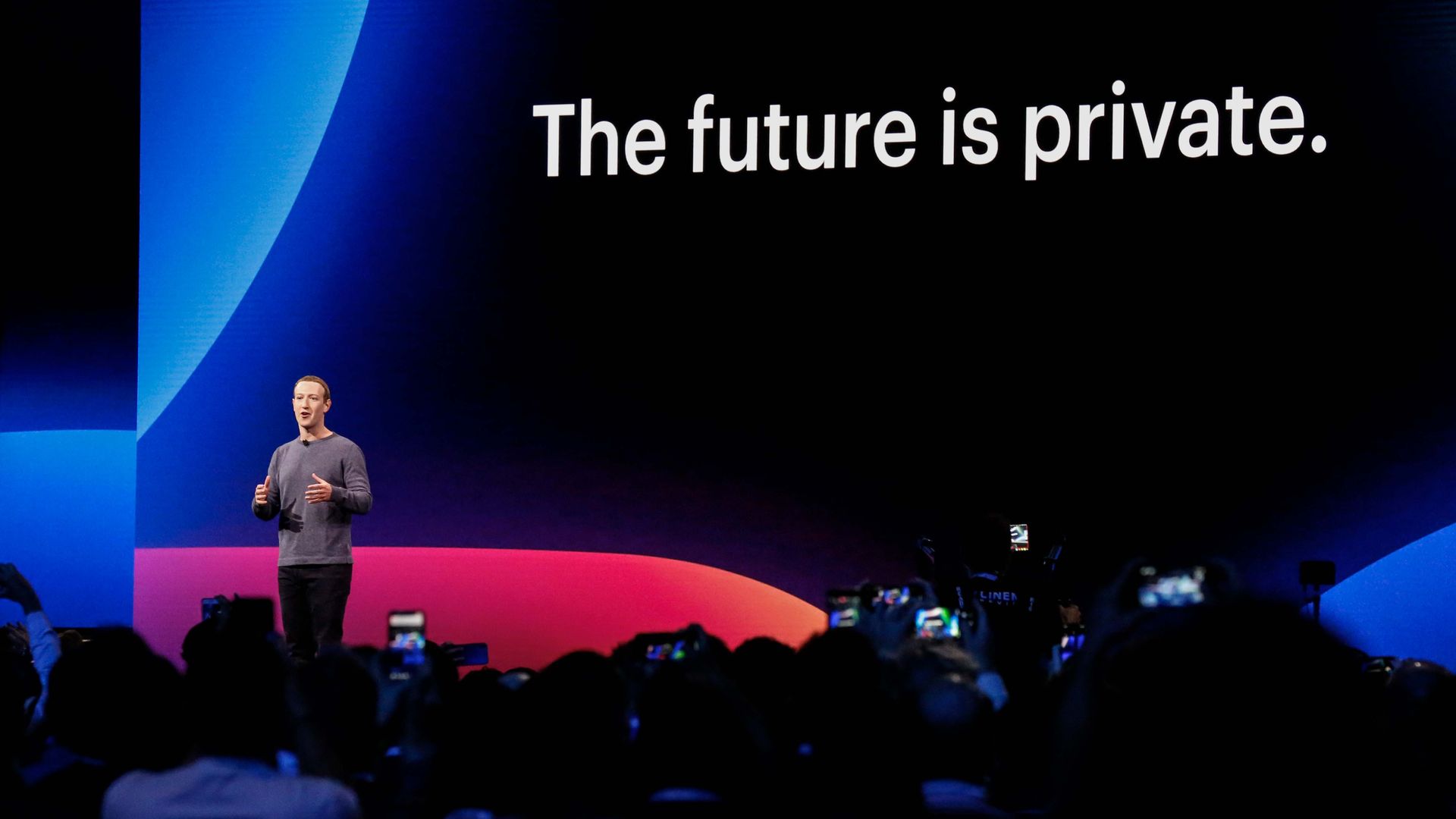 Photo of Mark Zuckerberg on stage in front of a slide reading "The future is private"