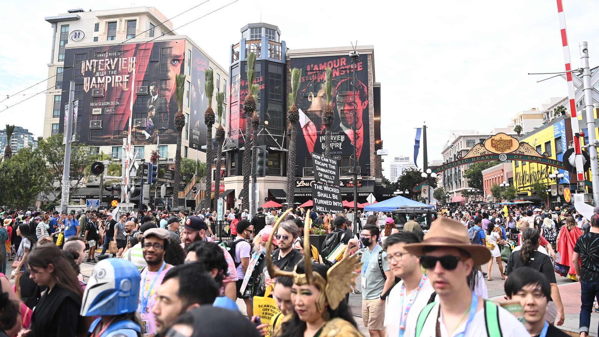 A crowd of Comic-Con attendees walks from the Gaslamp Quarter to the San Diego Convention Center