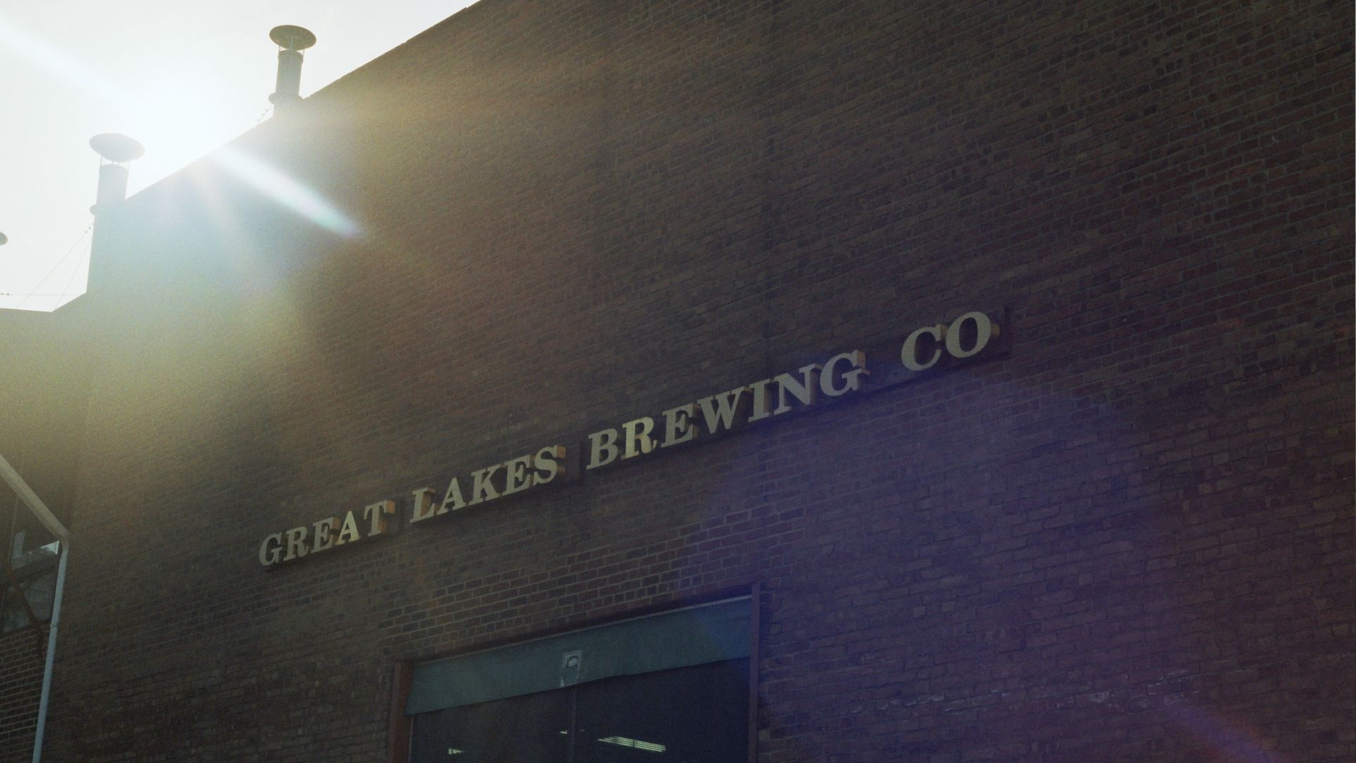 A brick wall with letters reading "GREAT LAKES BREWING CO"