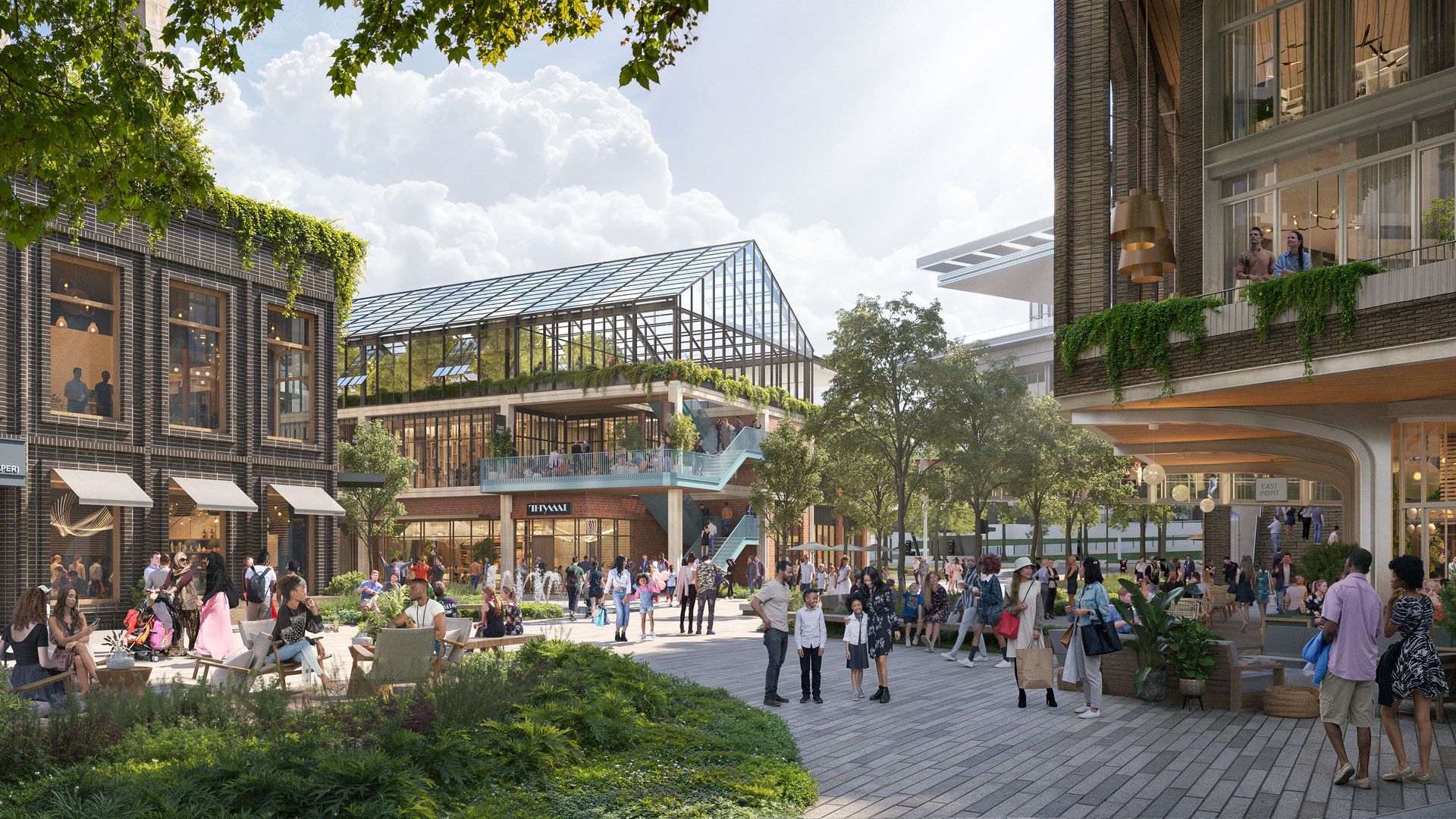Sunny urban plaza with a glass-roof conservatory at center, brick buildings with ivy on both sides, elevated glass walkway, and crowds of people strolling, seated, and chatting.