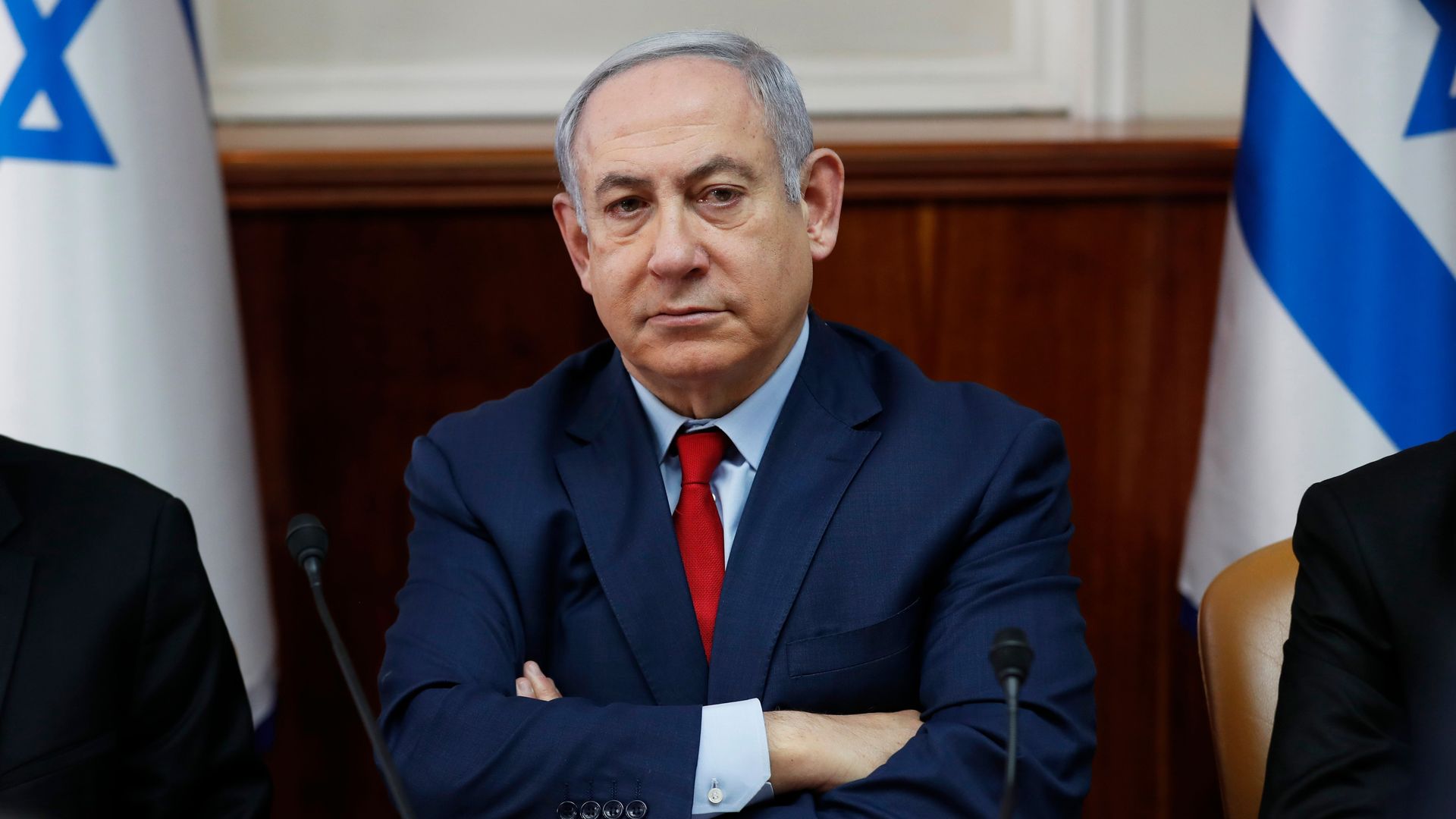 Benjamin Netanyahu with his arms folded