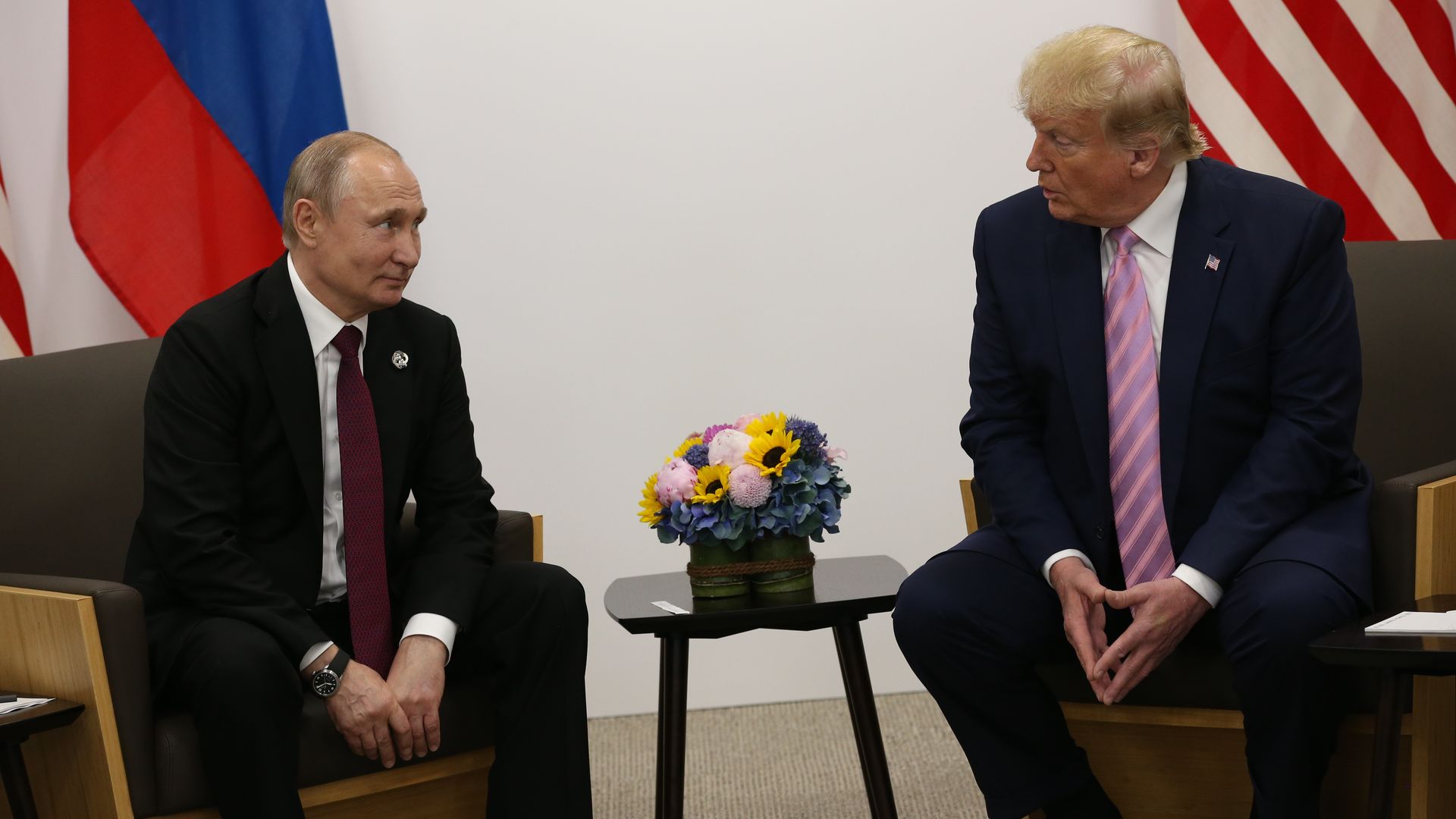 President Donald Trump (R) and Russian President Vladimir Putin (L) attend their bilateral meeting at the G20 Osaka Summit 2019, in Osaka, Japan