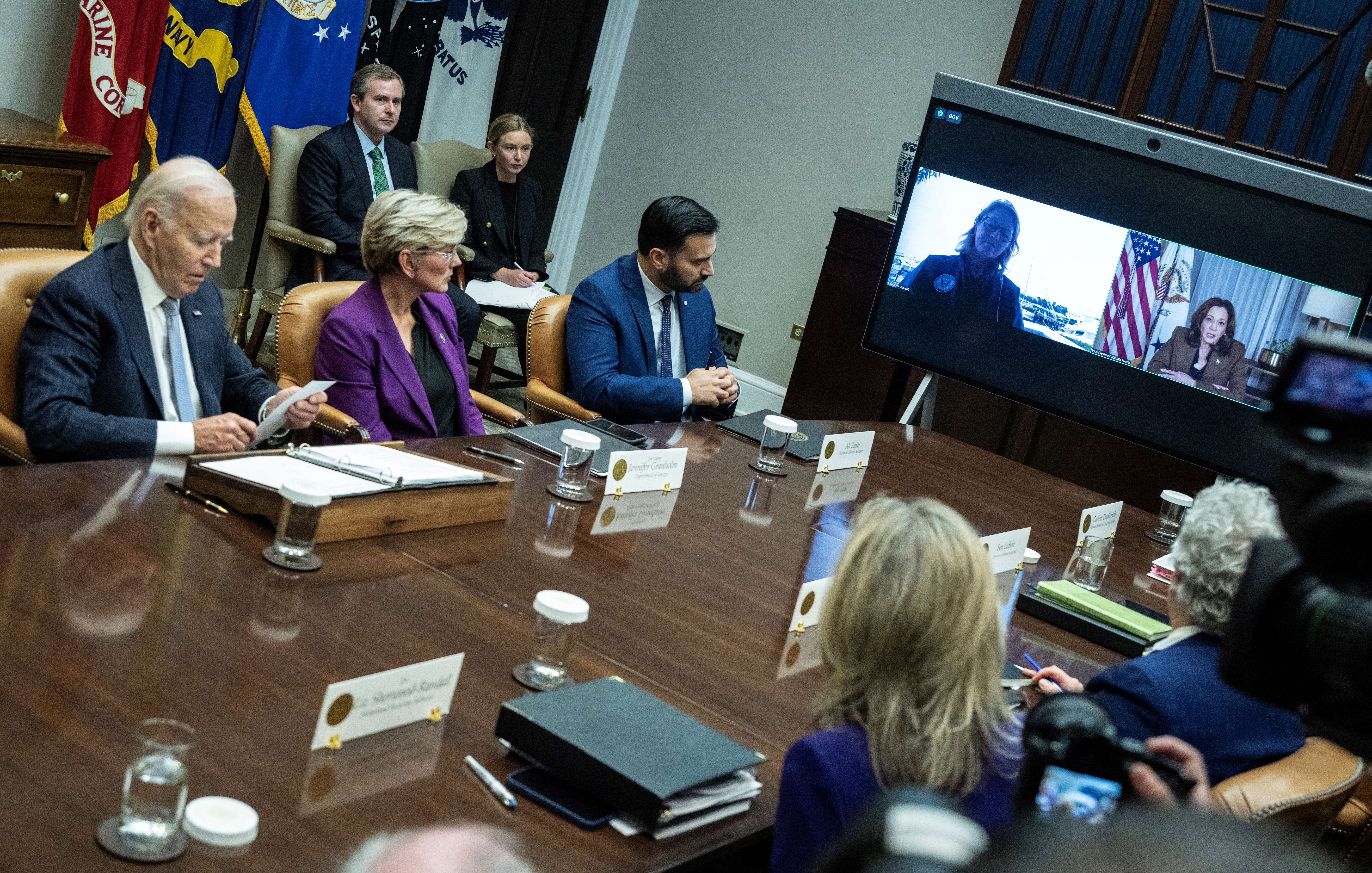 US President Joe Biden looks down as US Vice President and presidential candidate Kamala Harris speaks via video link during an update on the federal government's response to Hurricanes Milton and Helene, at the White House 