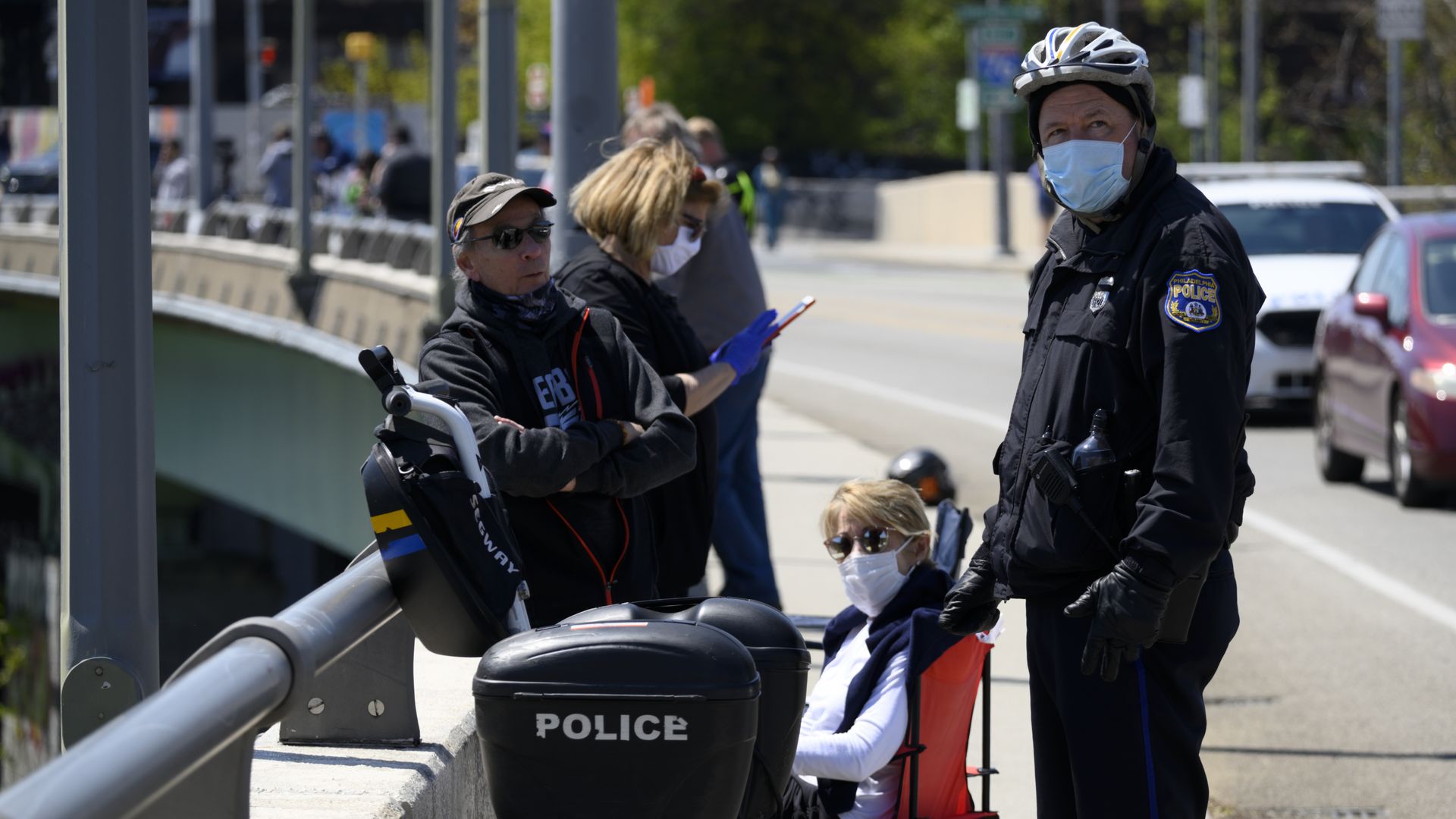Philadelphia cops watching an airshow, while wearing face masks because of coronavirus