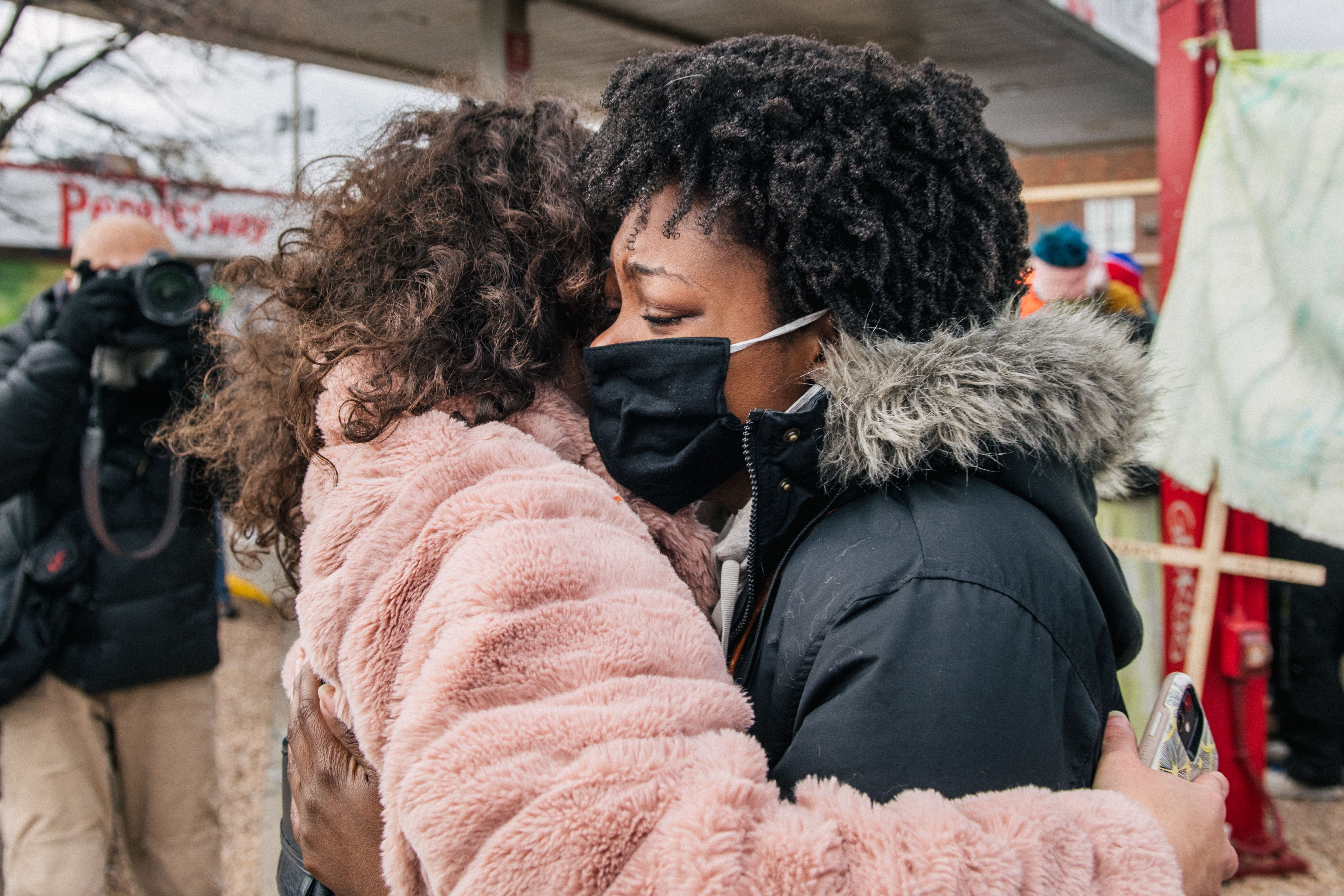atience Zelanga (R) is embraced after hearing the verdict in Derek Chauvin trial at the intersection of 38th Street and Chicago Avenue on April 20, 2021 in Minneapolis,