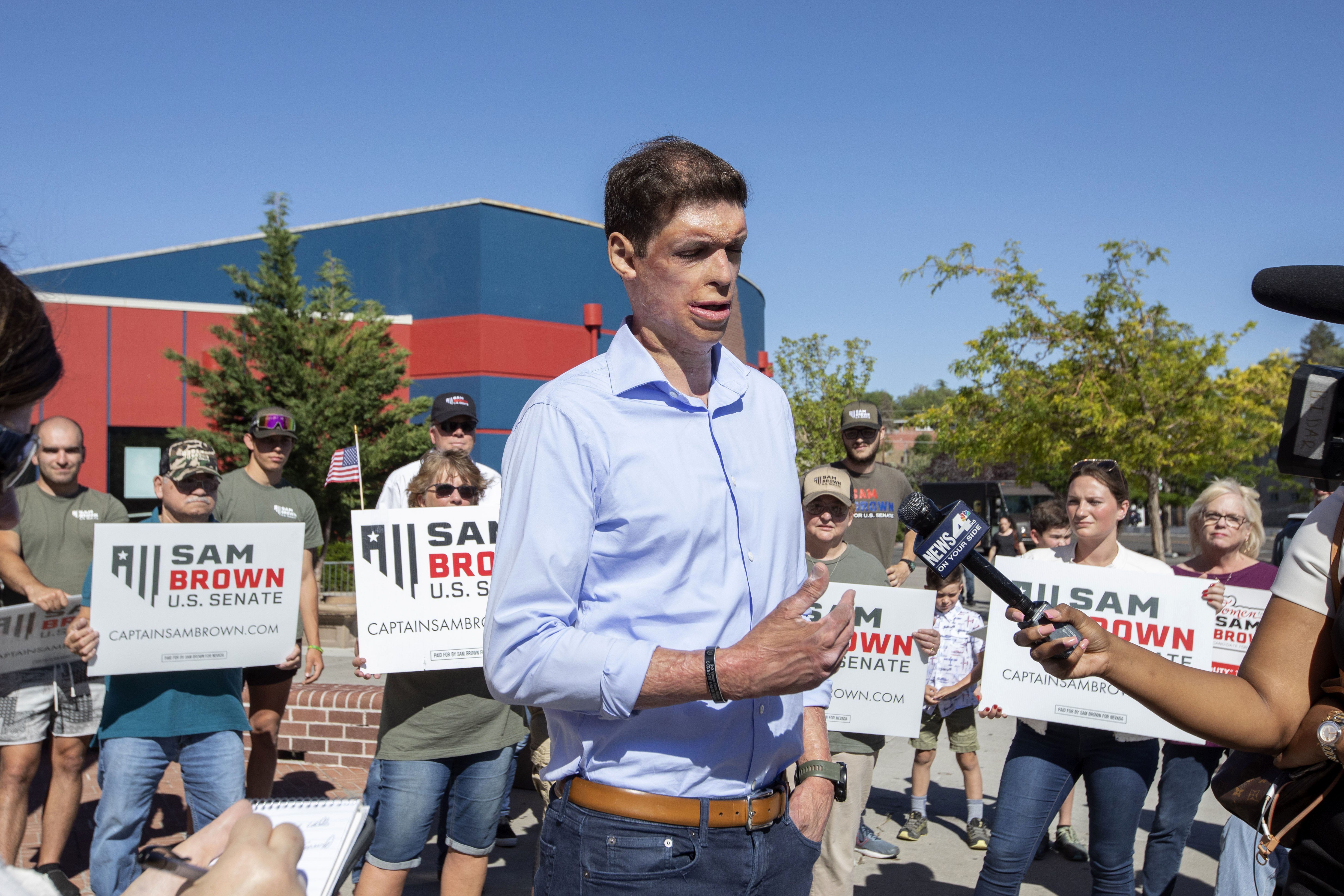 Republican Senate candidate Sam Brown speaks to the media in Reno, Nev.