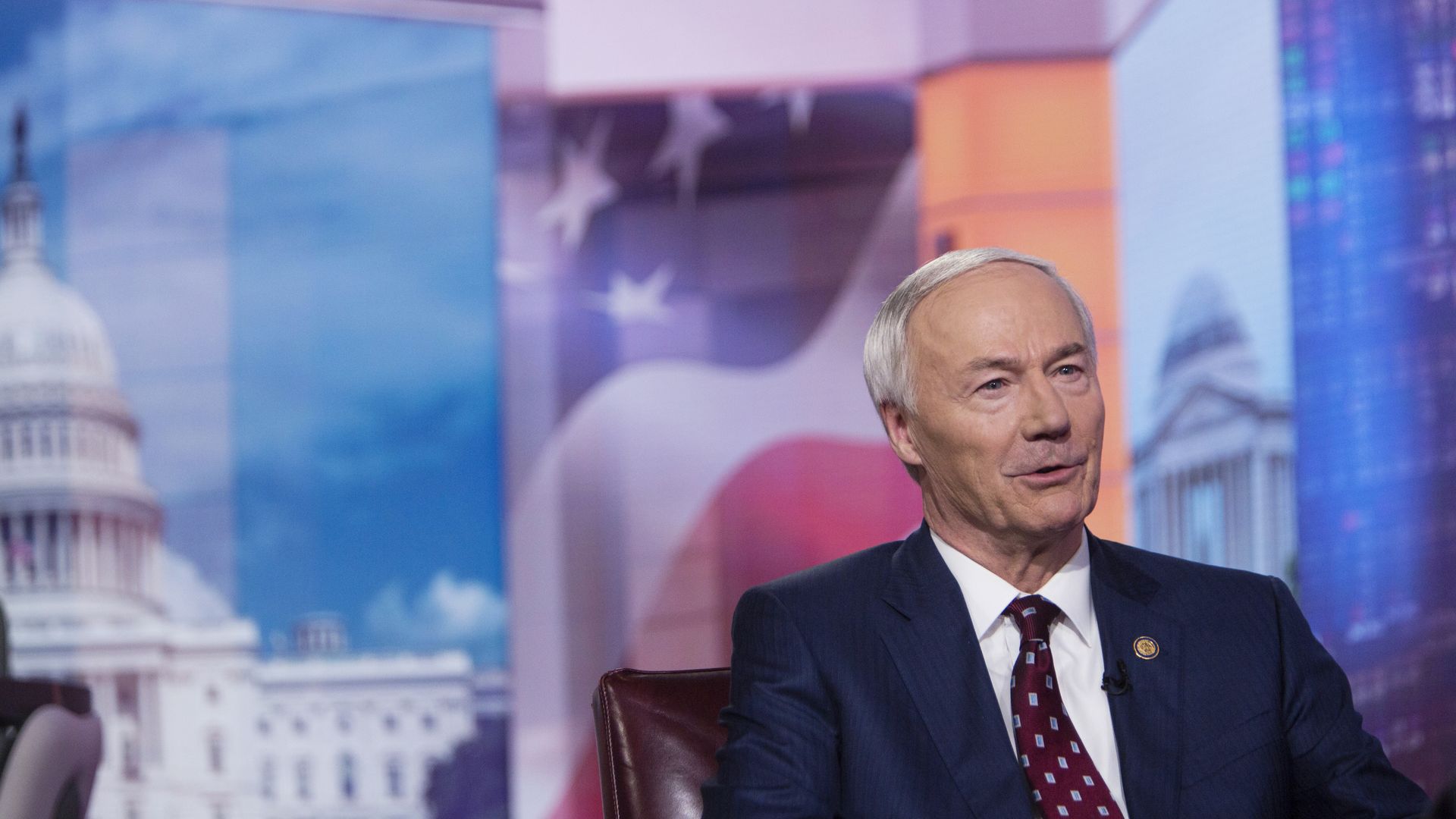 Photo of Asa Hutchinson sitting and speaking