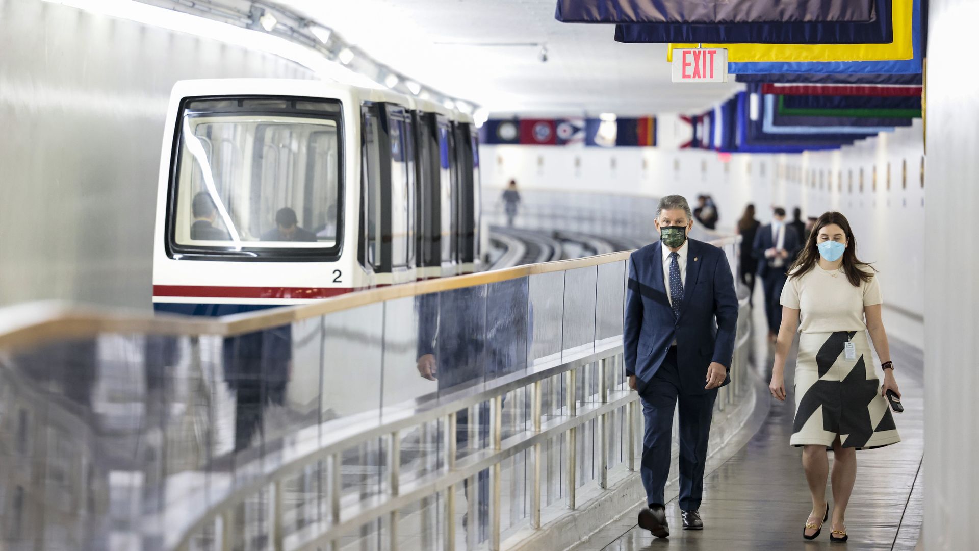 Sen. Joe Manchin is seen walking beside the Senate subway.