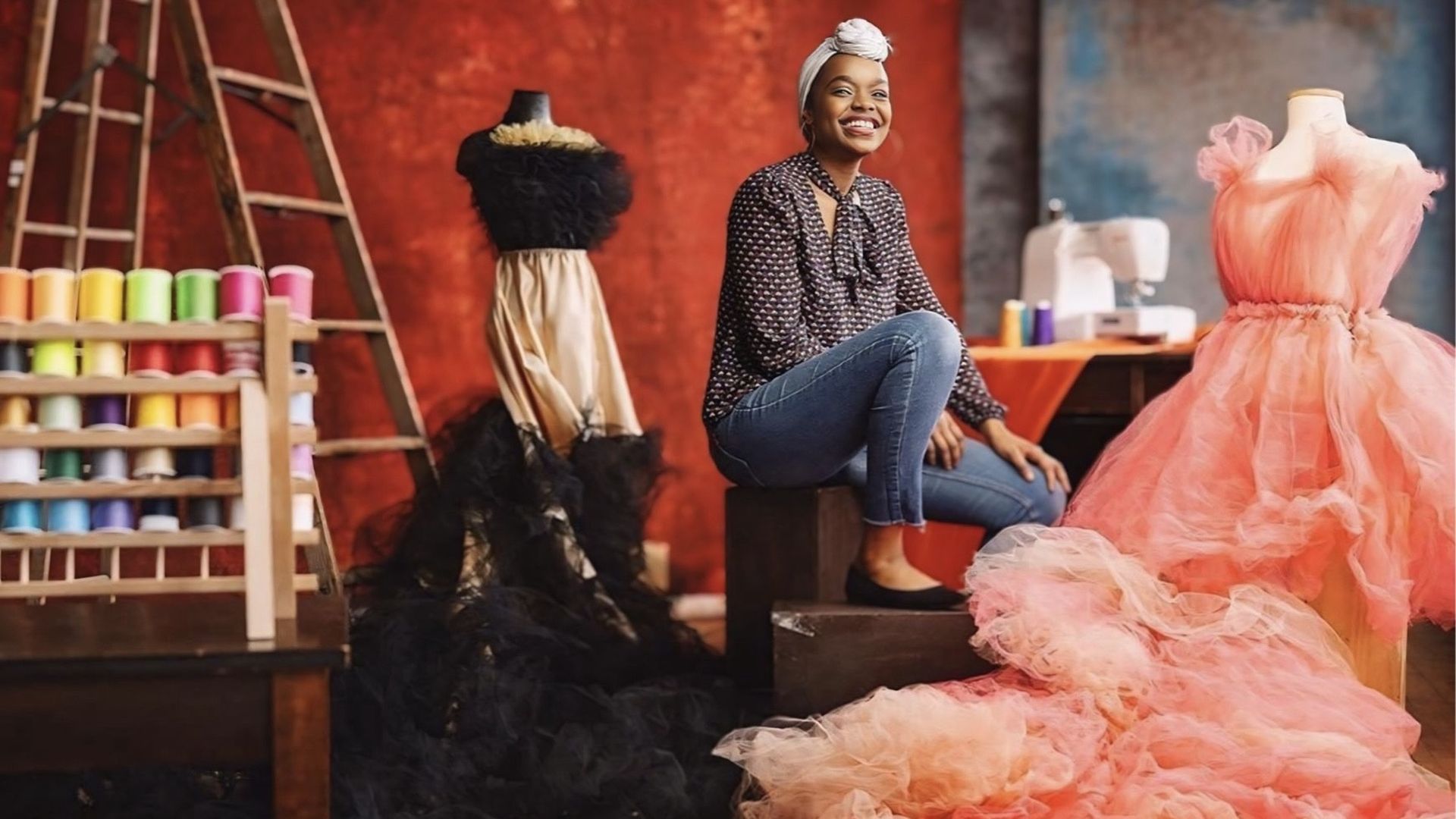 Belange sitting by a table