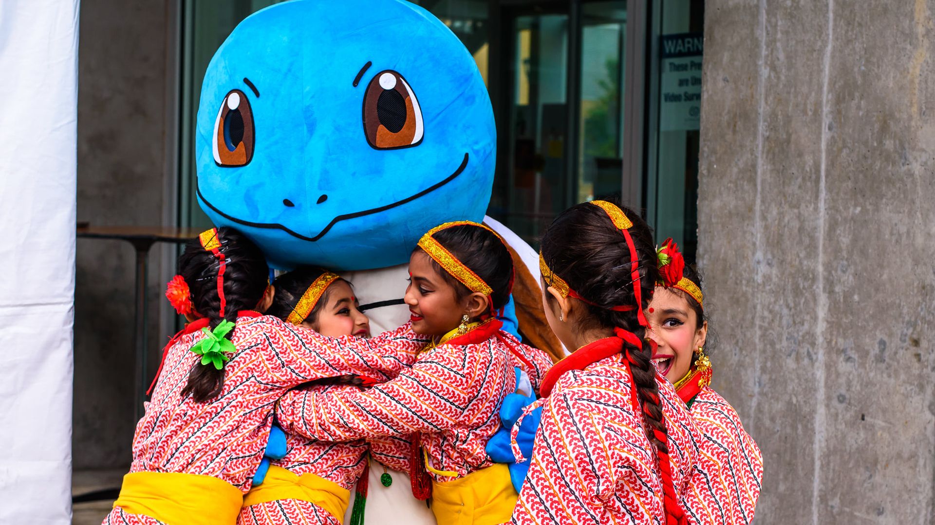 Kids hugging Squirtle