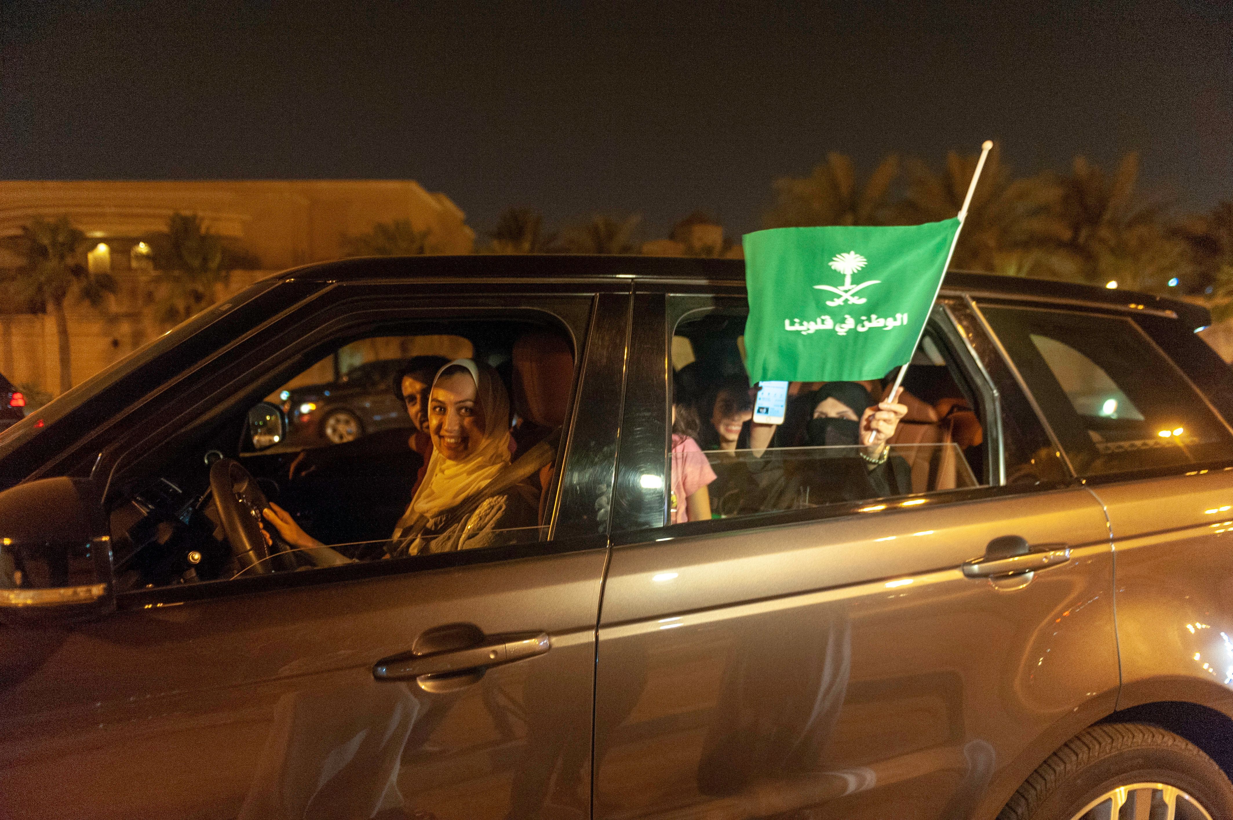 Saudi Arabian woman driving with friends.