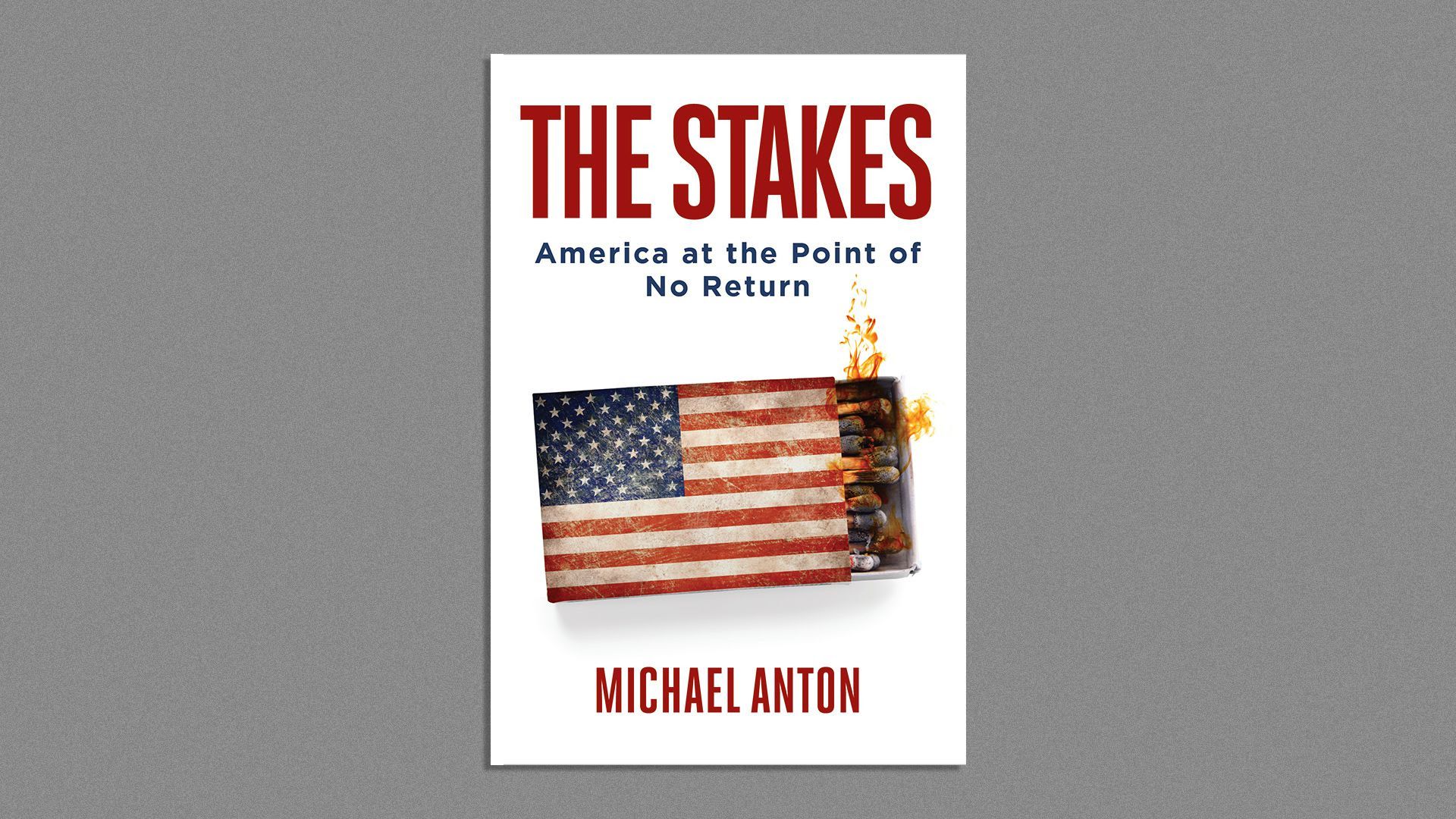 The book over of "The Stakes" shows a match box with the America flag on it in flames
