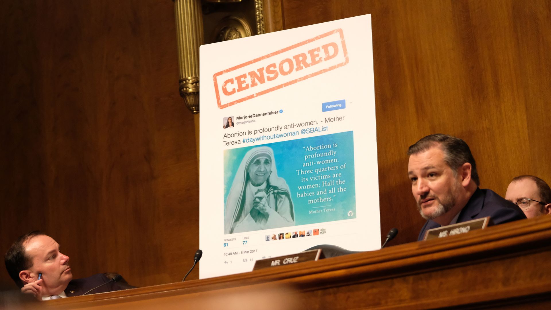 Ted Cruz points to censored poster board