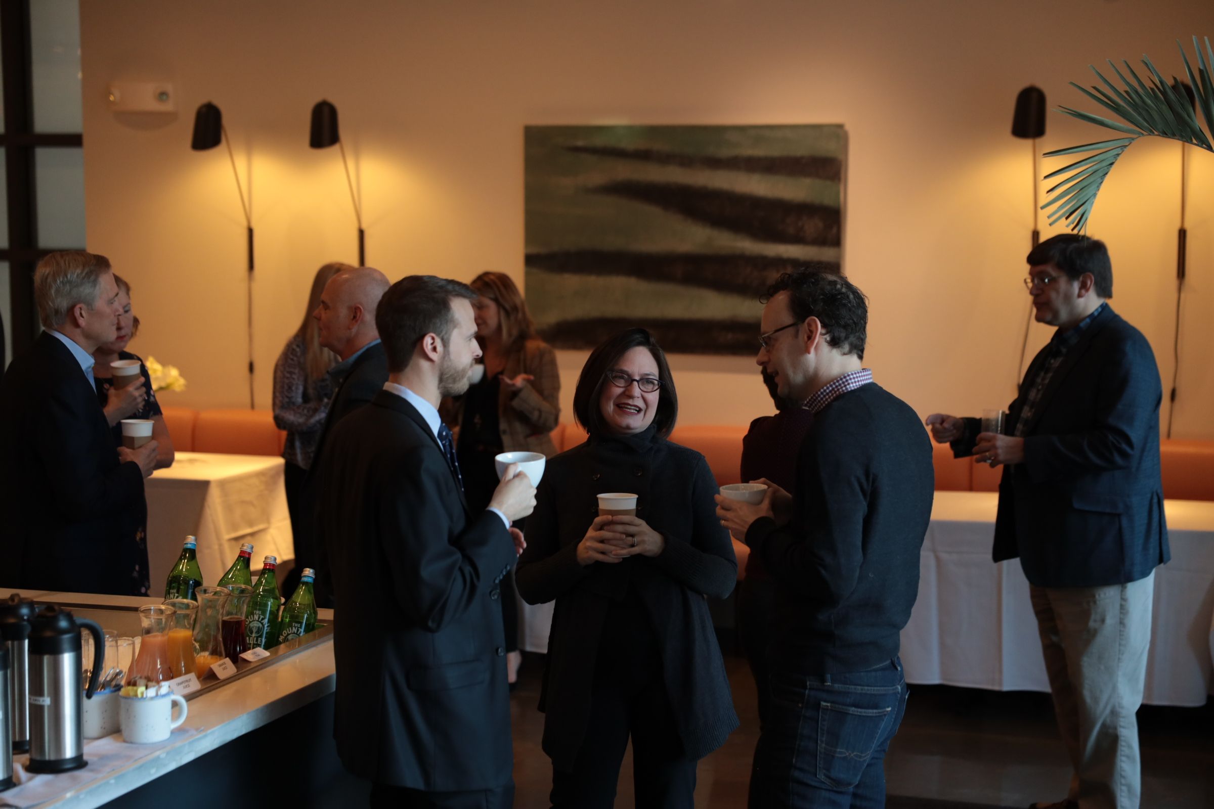 Guests chatting before the breakfast begins. 