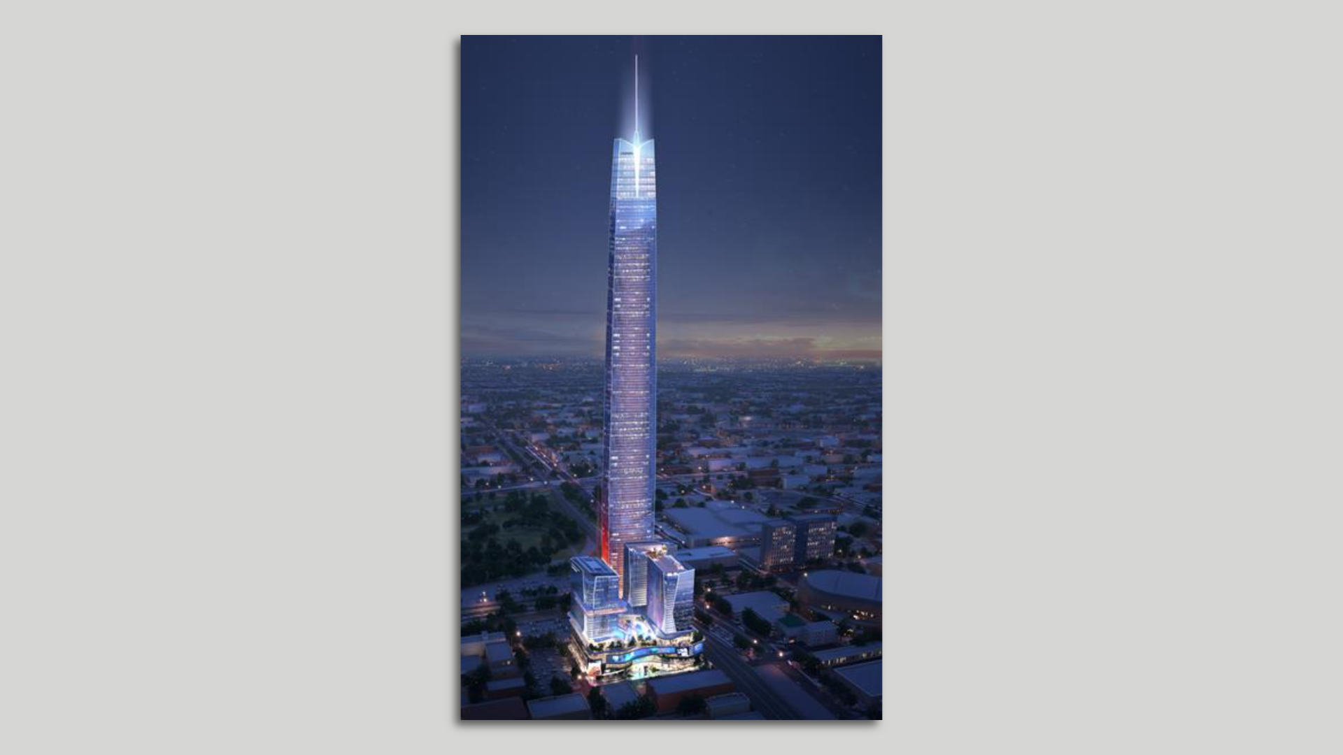 A purple skyscraper towers above its surroundings against a night sky.