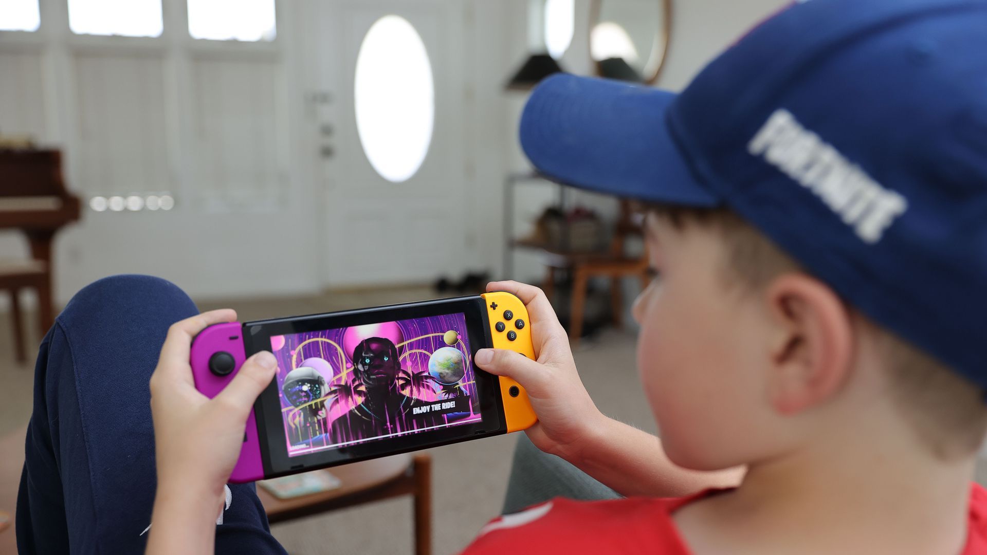 A child plays a video game on a Nintendo Switch.