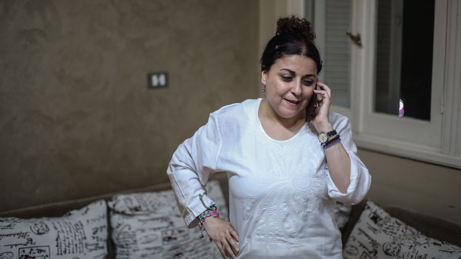 Egyptian activist and journalist Esraa Abdel Fattah speaks on the phone 