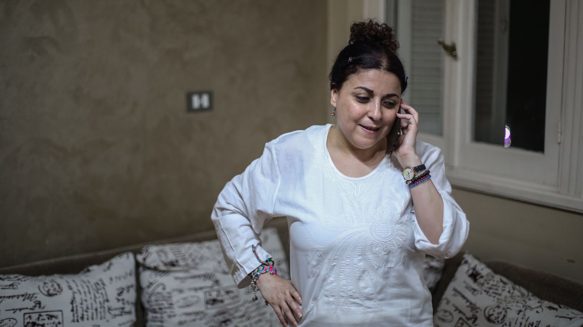 Egyptian activist and journalist Esraa Abdel Fattah speaks on the phone
