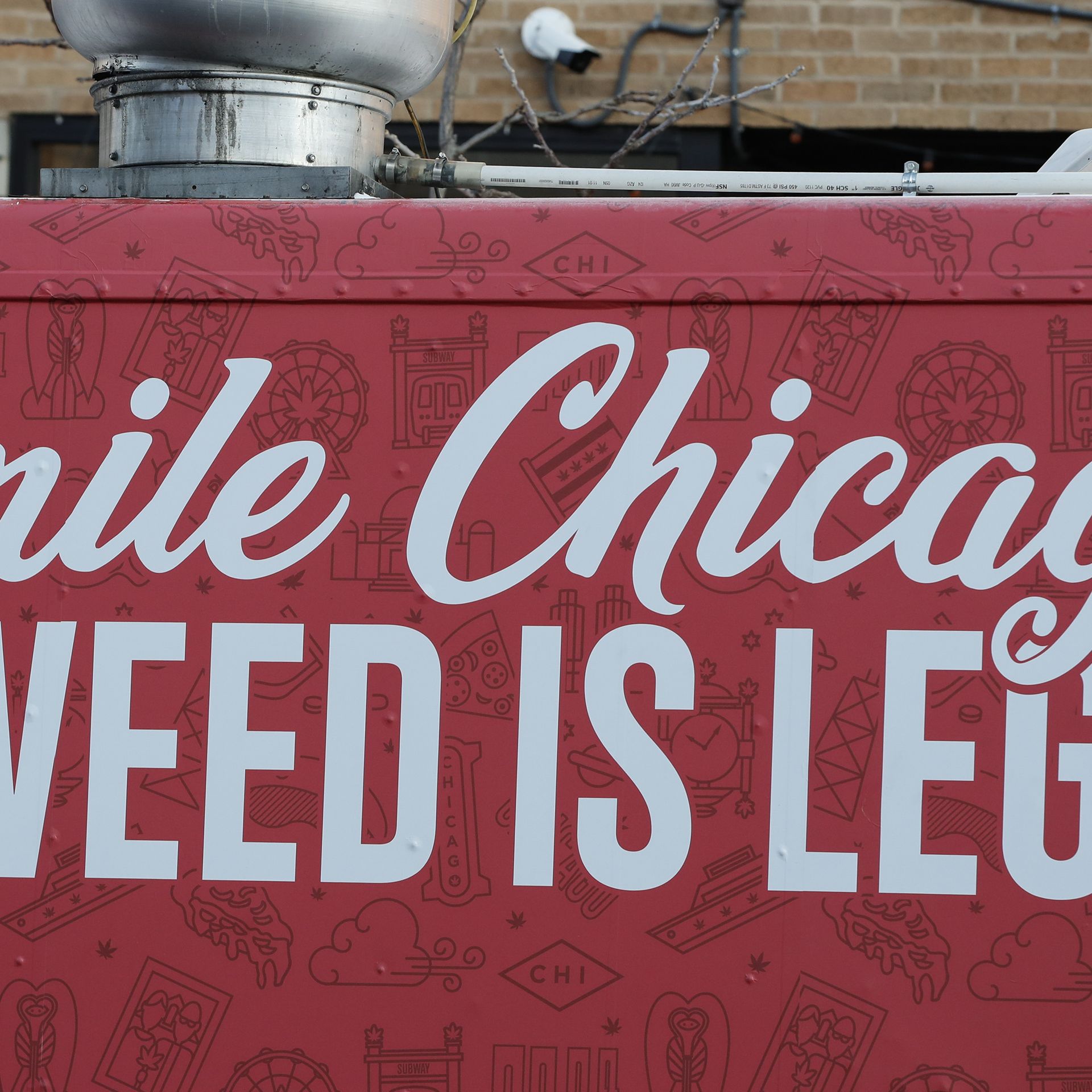 Photo of a sign that says "Smile Chicago, Weed is Legal" 