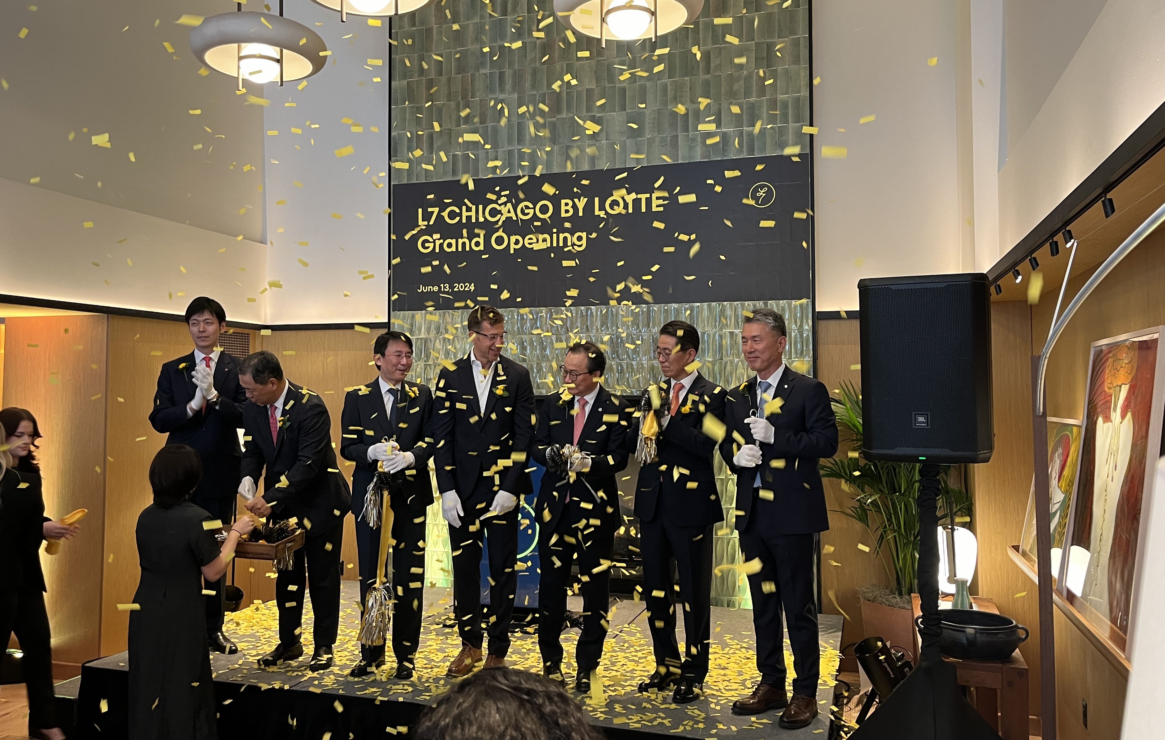 men on stage with confetti around them 