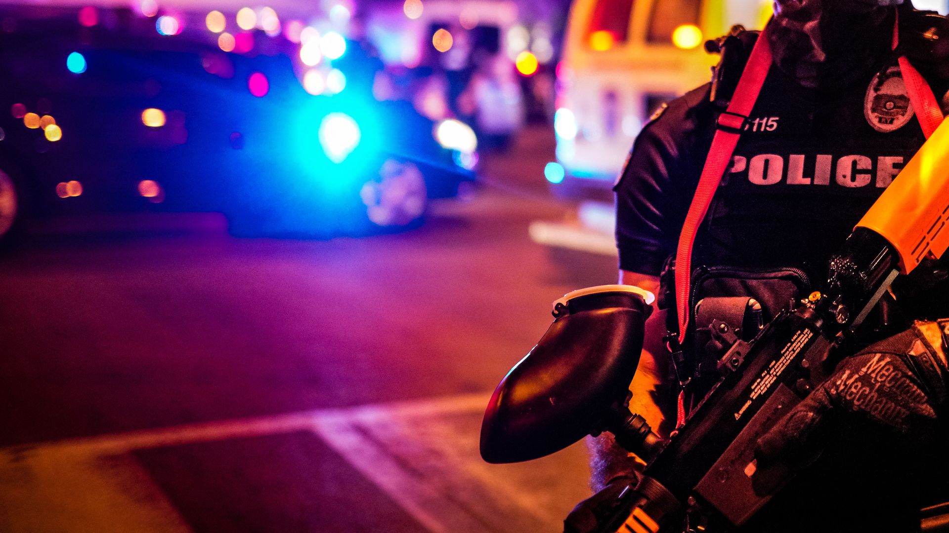 Police officers stand guard during a protest in Louisville, Kentucky.