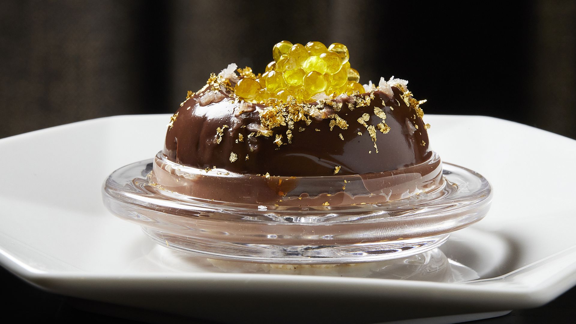 A dark chocolate cake dessert with gold leaf at TheSaga. Photograph by Deb Lindsey