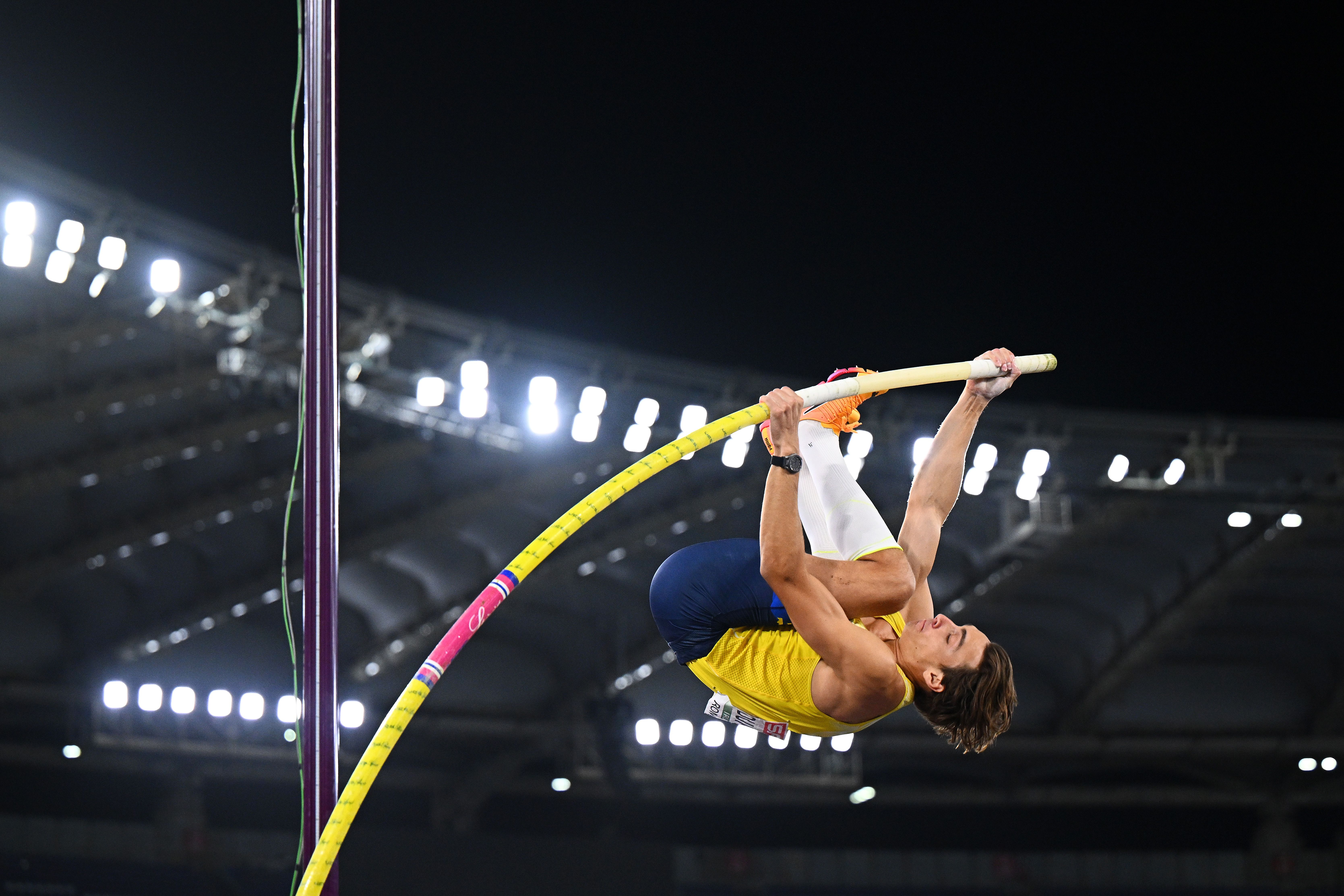 Mondo Duplantis prepares to launch himself over as he pole vaults.