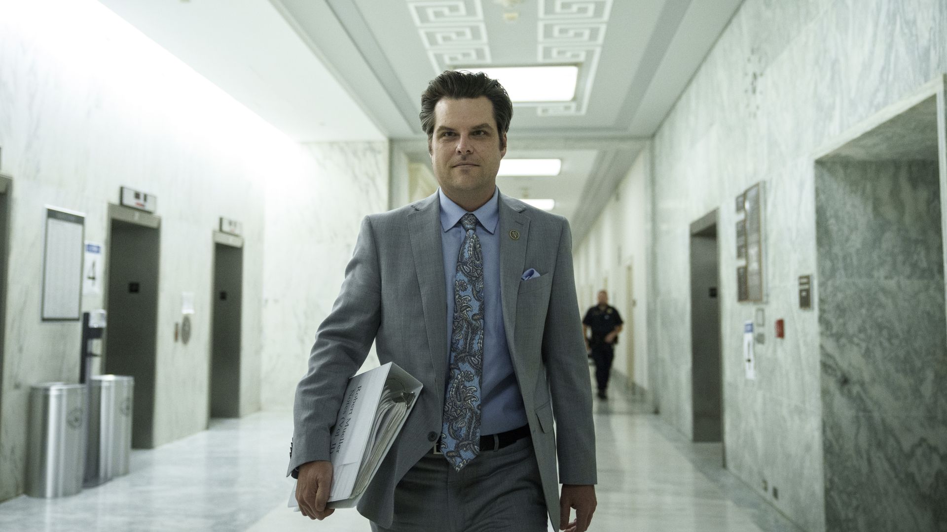 Rep. Matt Gaetz is seen walking down a hall in Congress.