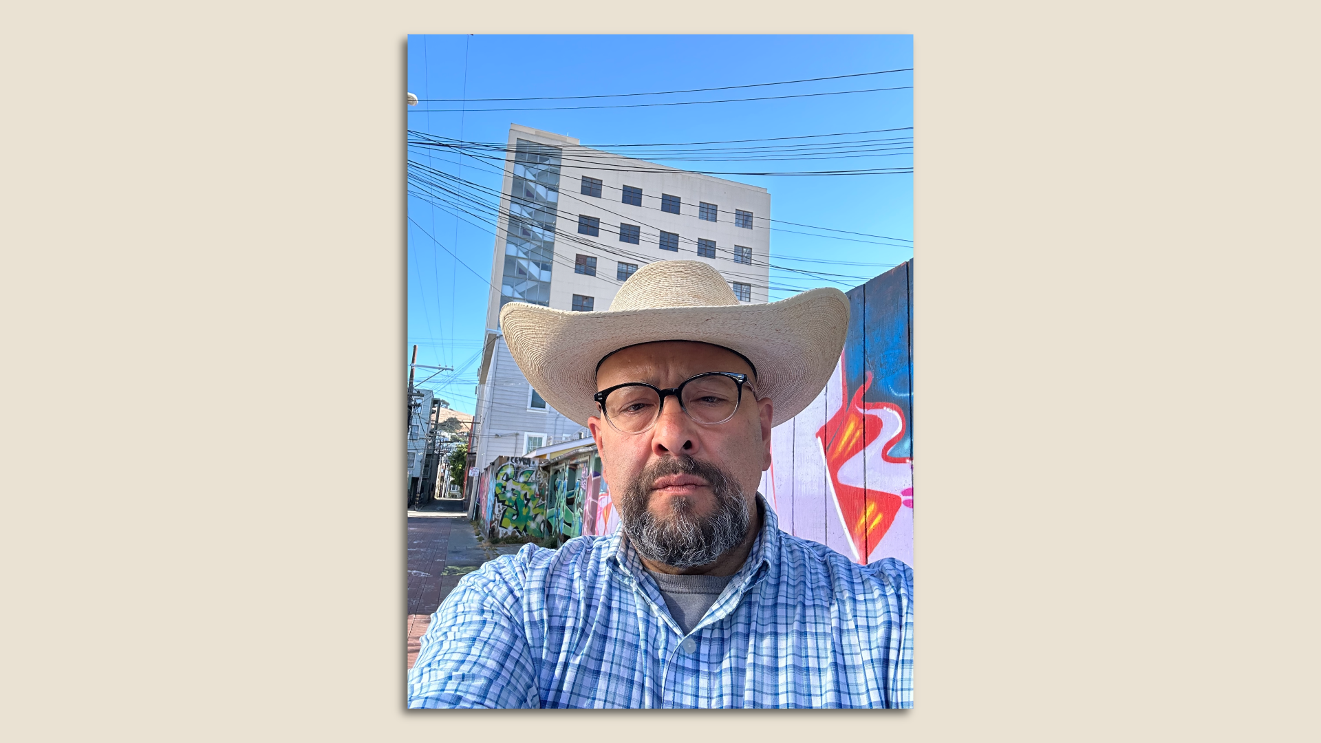 Photo of Jaime Gutierrez in a cowboy hat standing on a street