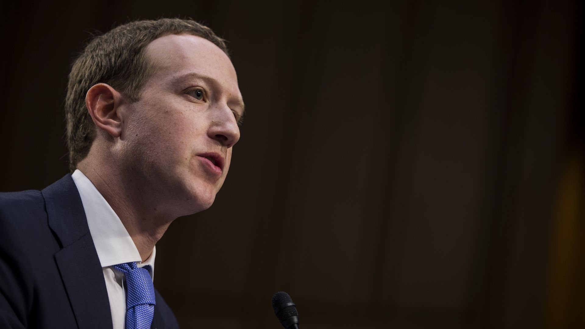Photo of Mark Zuckerberg in a blue tie and jacket