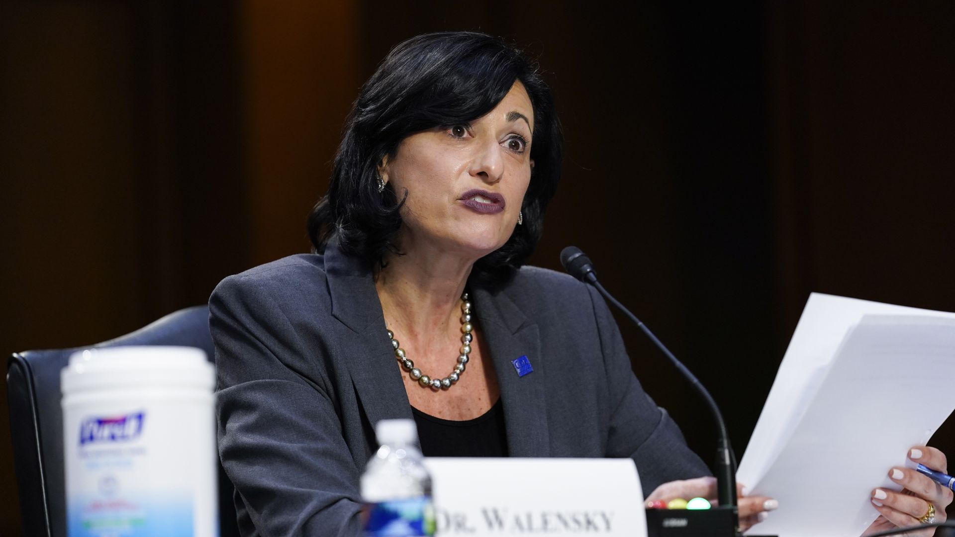 Photo of Rochelle Walensky sitting down and speaking into a mic