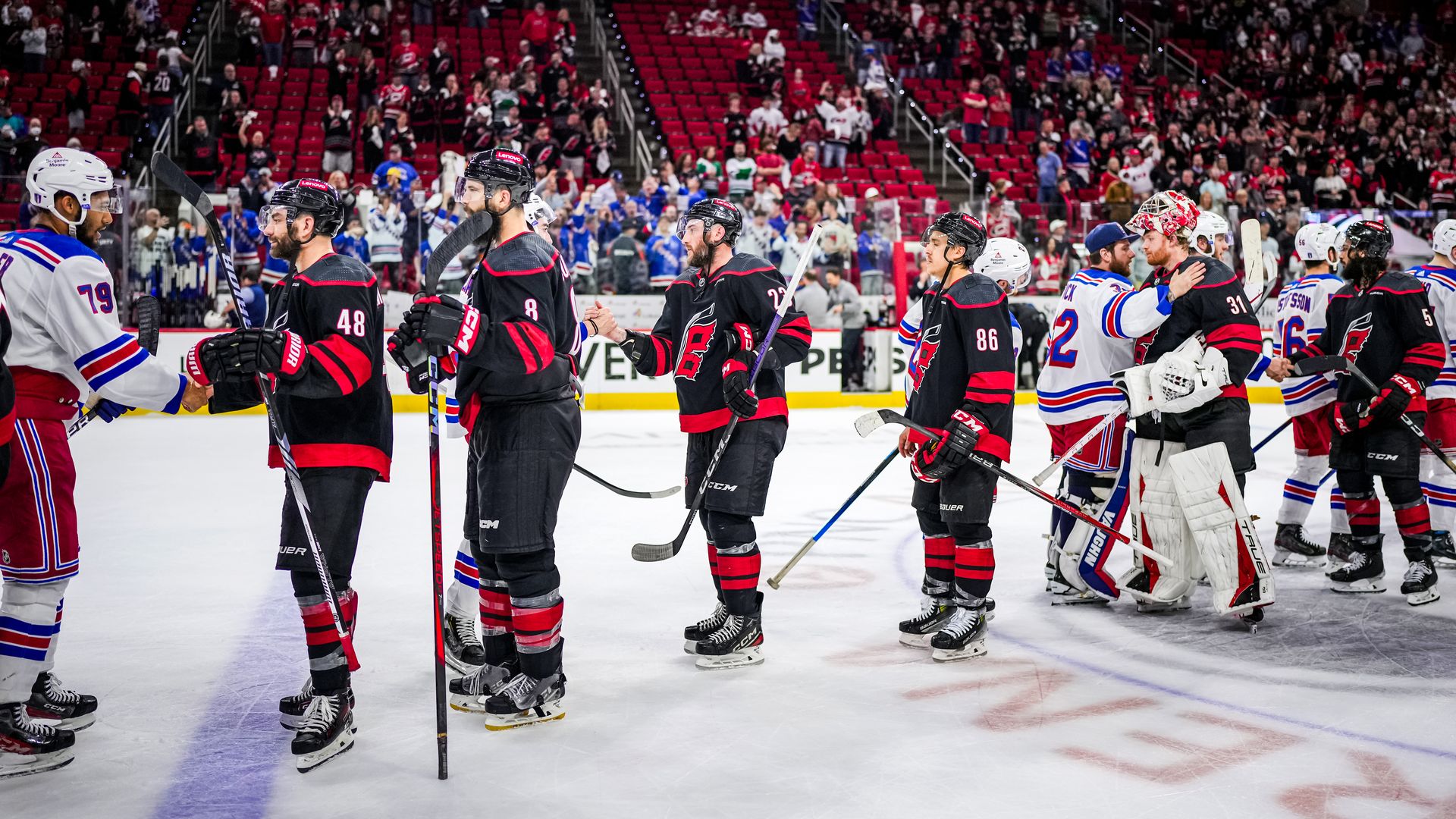 RALEIGH, NORTH CAROLINA - MAY 16: New York Rangers and Carolina Hurricanes players shake hands after Game Six of the Second Round of the 2024 Stanley Cup Playoffs at PNC Arena on May 16, 2024 in Raleigh, North Carolina. (Photo by Josh Lavallee/NHLI via Getty Images)