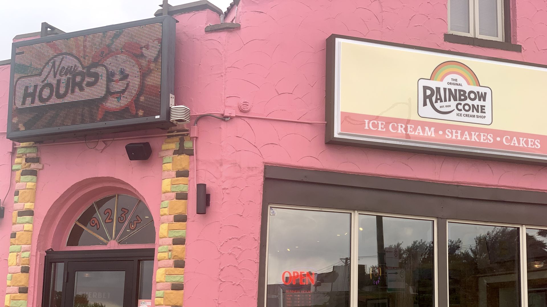 Pink store with sign that reads Rainbow Cone.