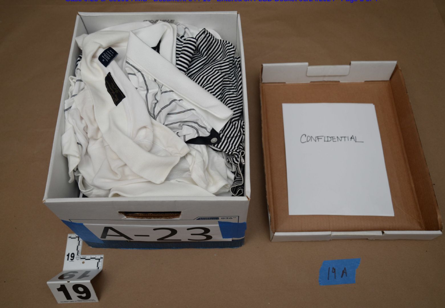 The trove of images shows papers strewn across the floor of the South Florida resort and boxes clearly marked "confidential" and "secret" containing a mix of documents and a random graveyard of dated newspaper clippings, golf shirts and binders.